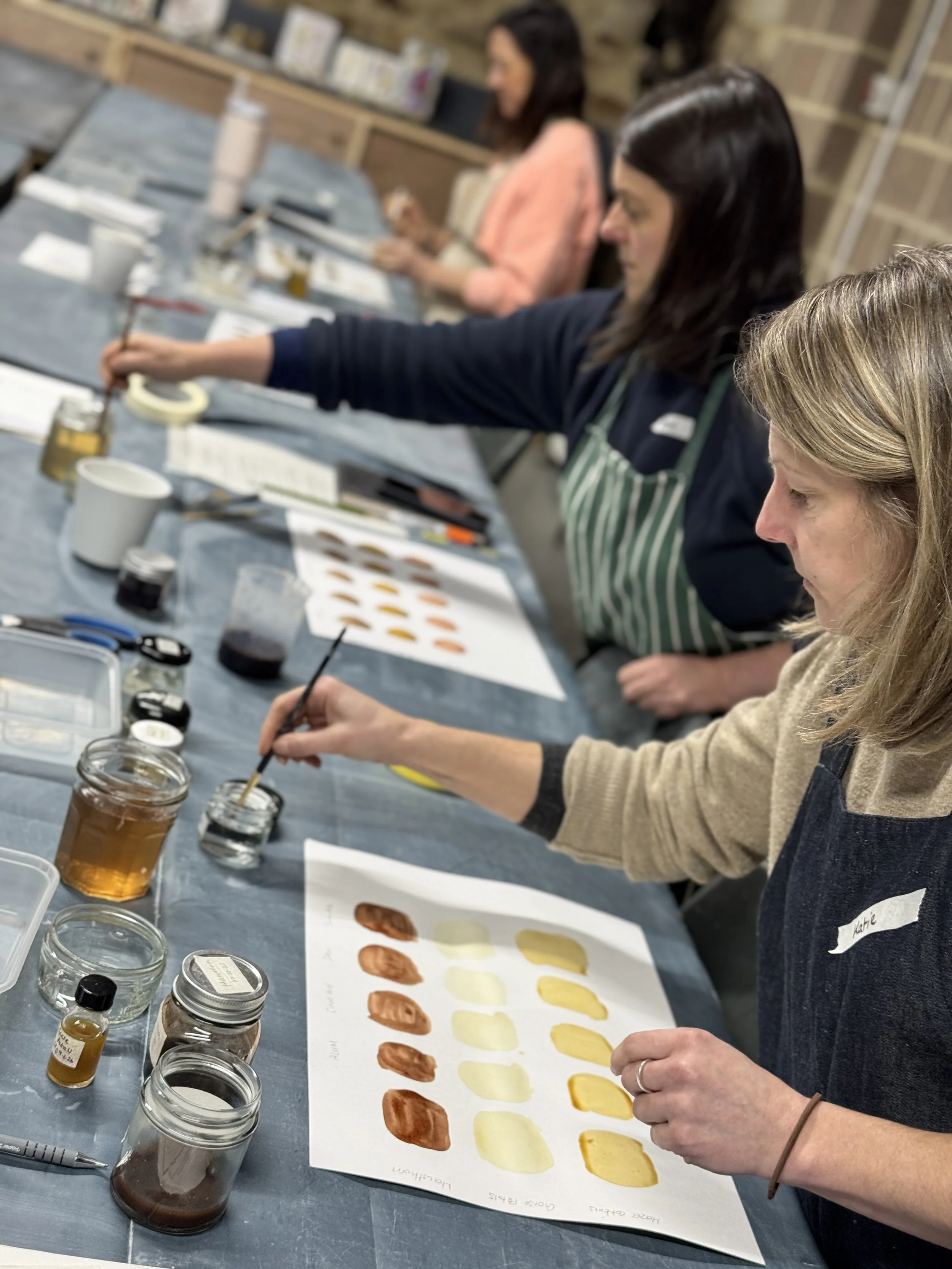 Students participating in an art workshop making wild and natural inks from botanicals
