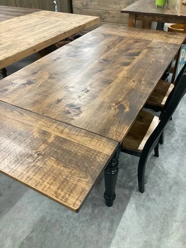 Turned black base with stained top harvest table plus extensions