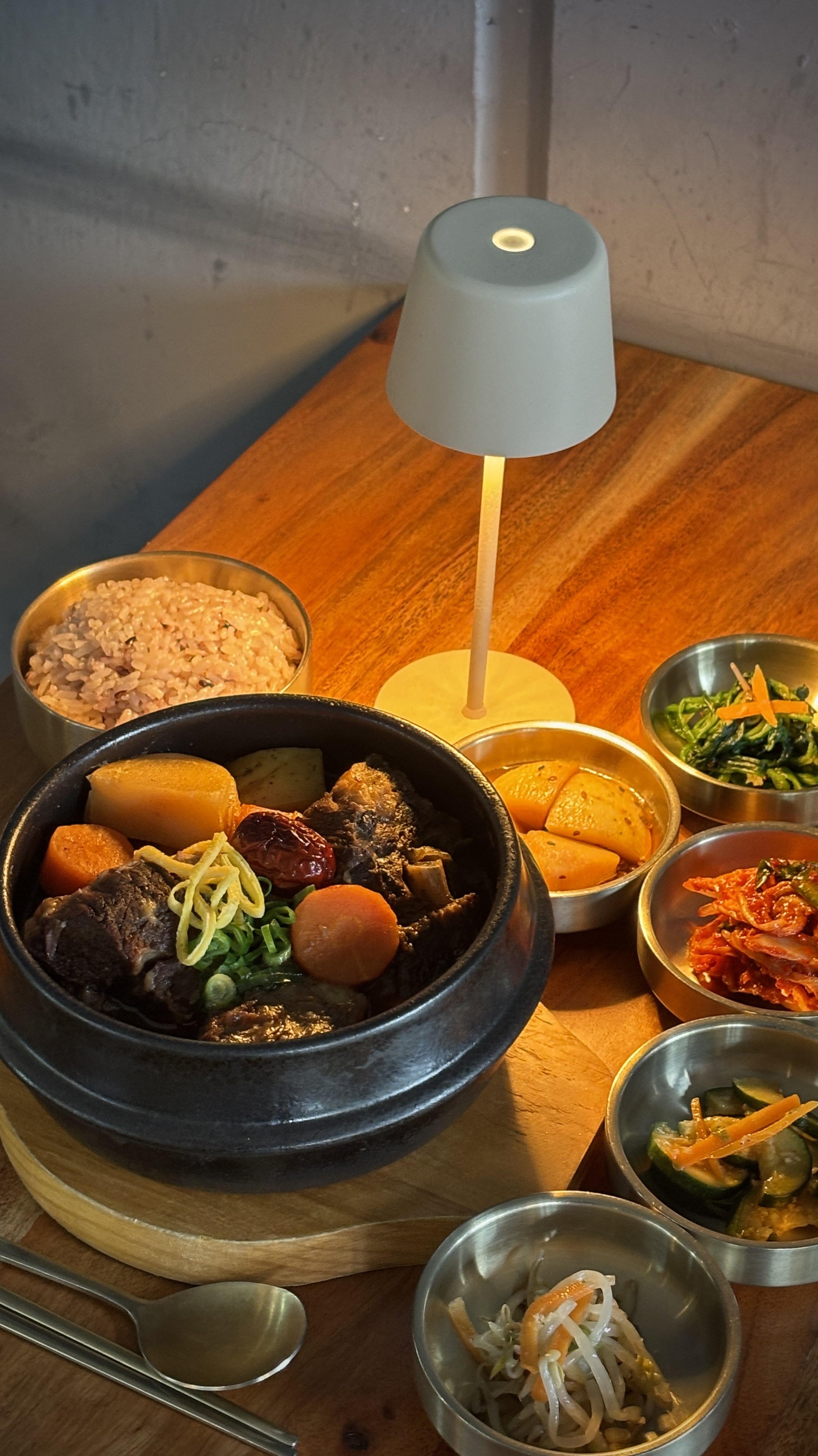 Galbi jjim, braised beef short ribs with multigrain rice and Korean banchan.
