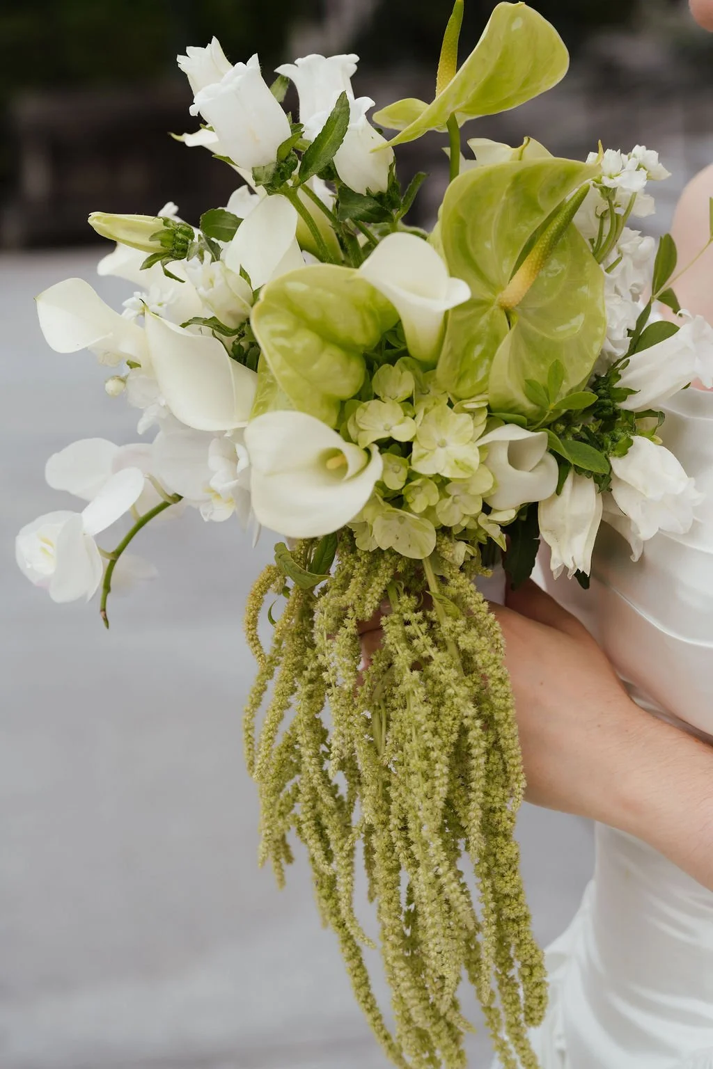 Green and white cascading bouquet By Love Letter Floral & Events in tacoma and Seattle Washington