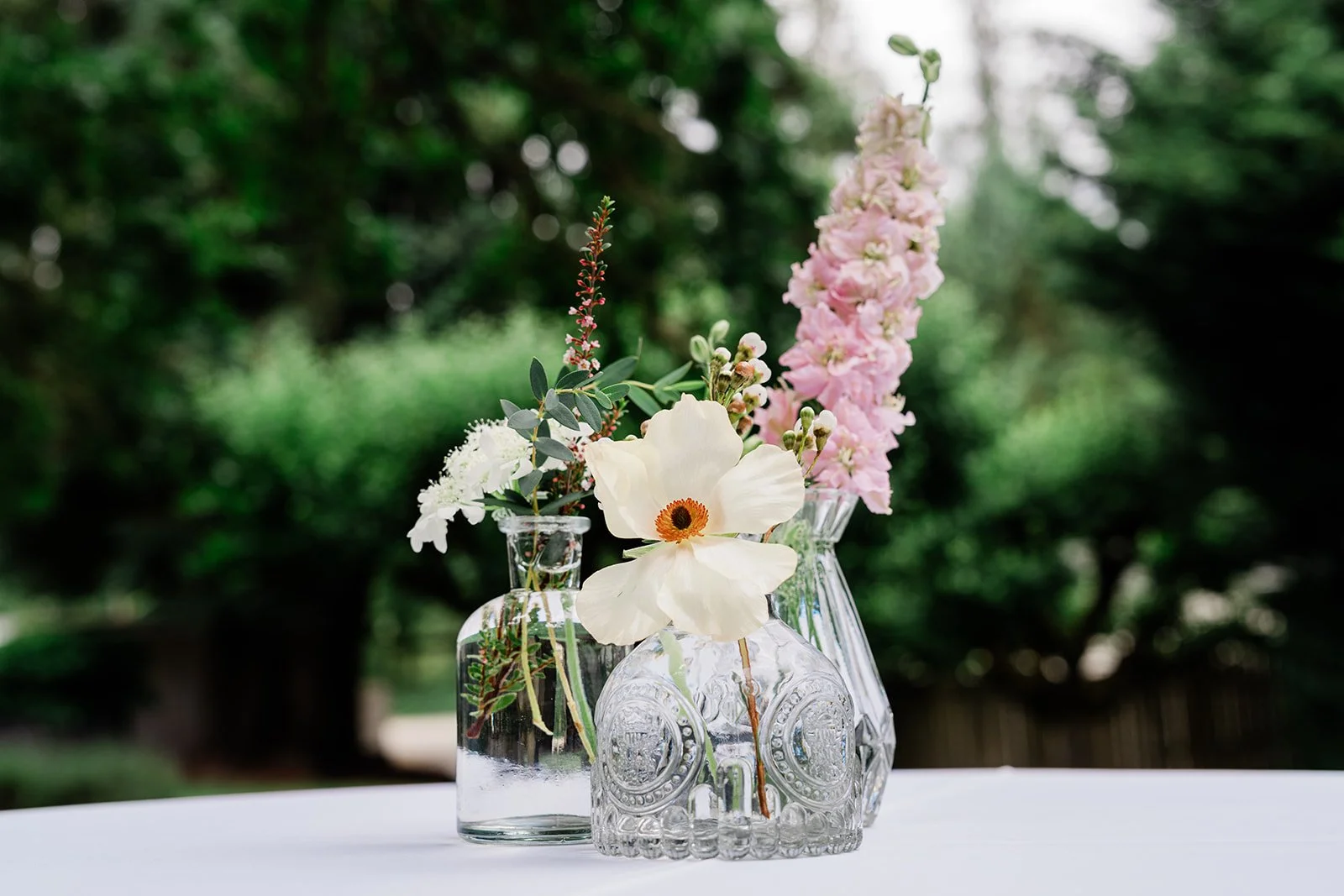 bud vases with blush flowers at a seattle wedding reception