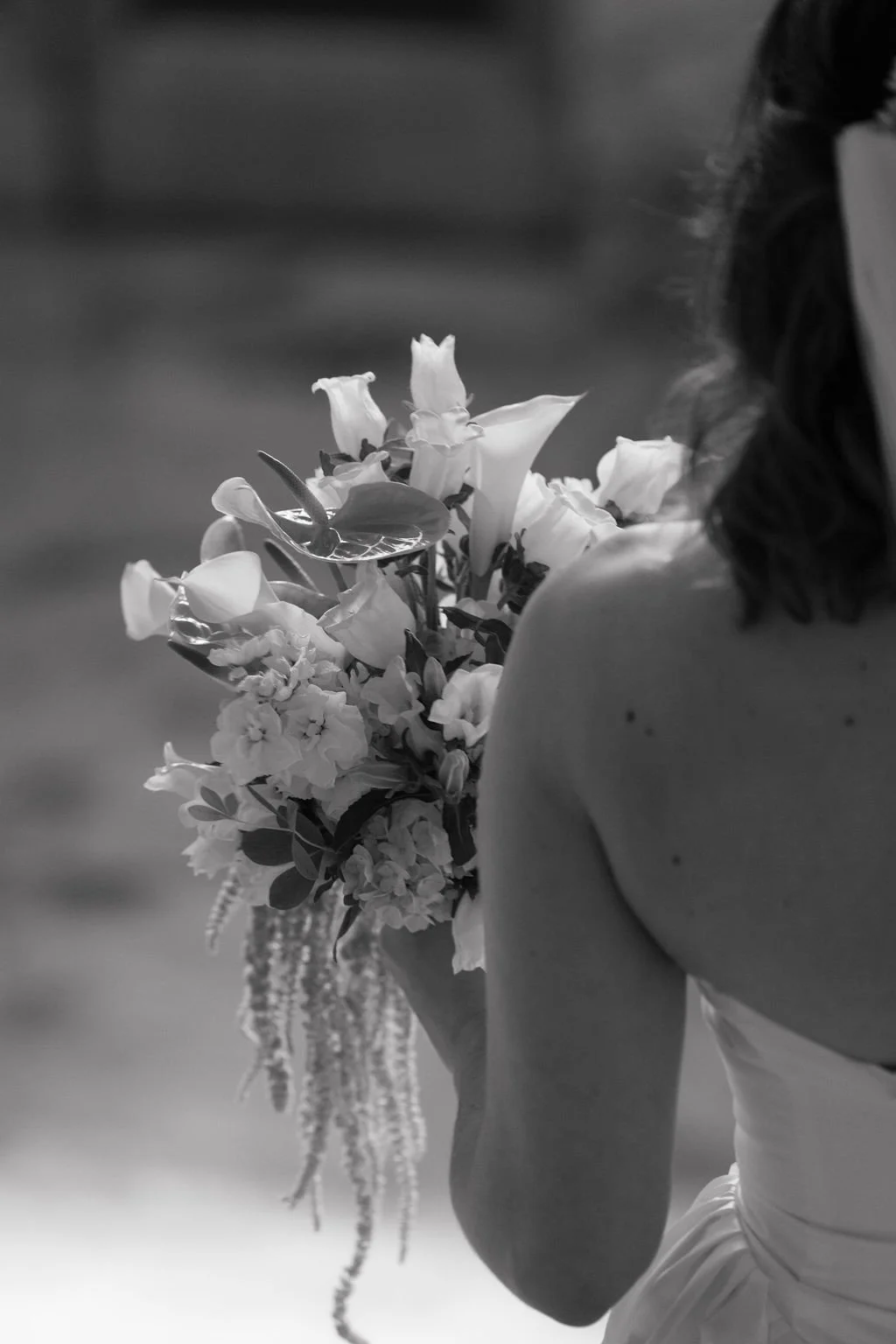 Black and white photo of a bride holding a bouquet at Pacific Northwest wedding