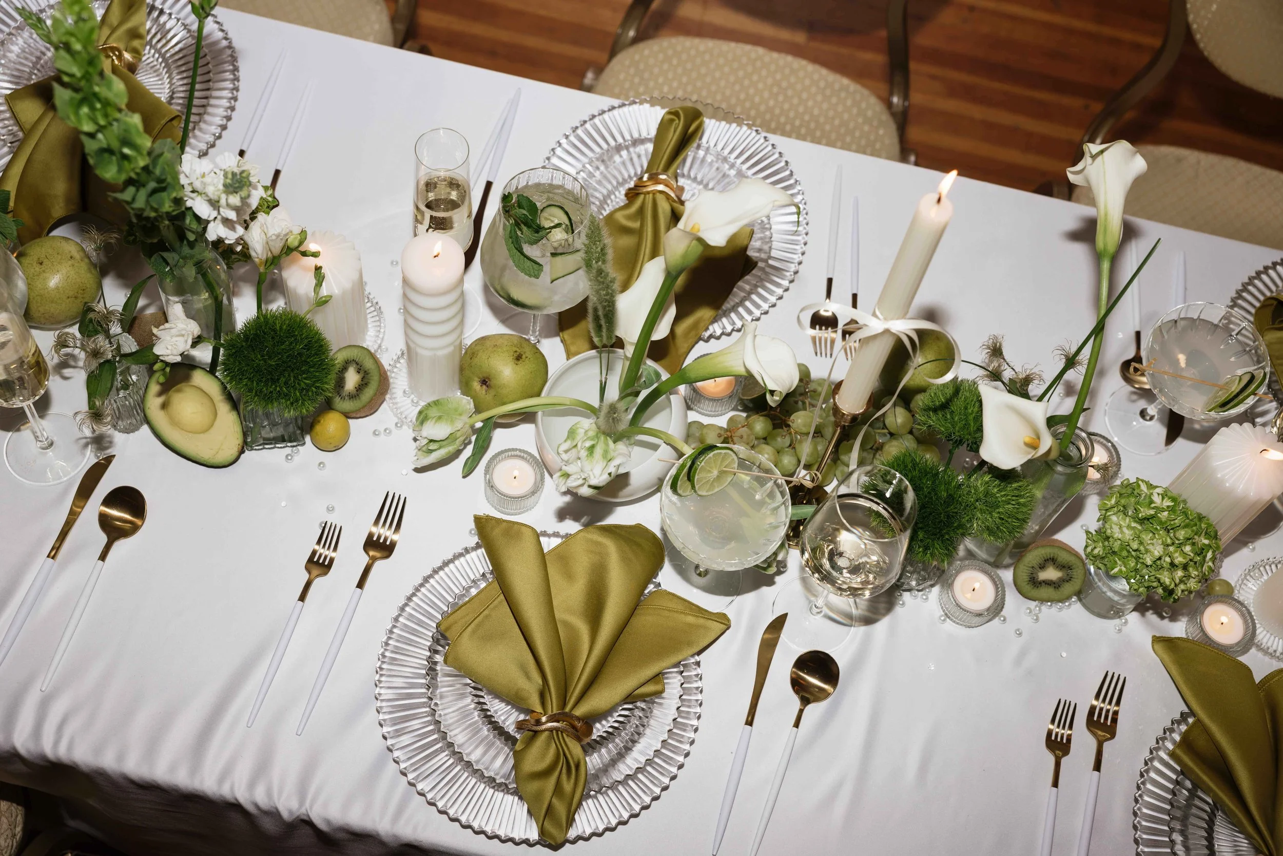Green and white wedding tablescape with flowers and fruit in Seattle