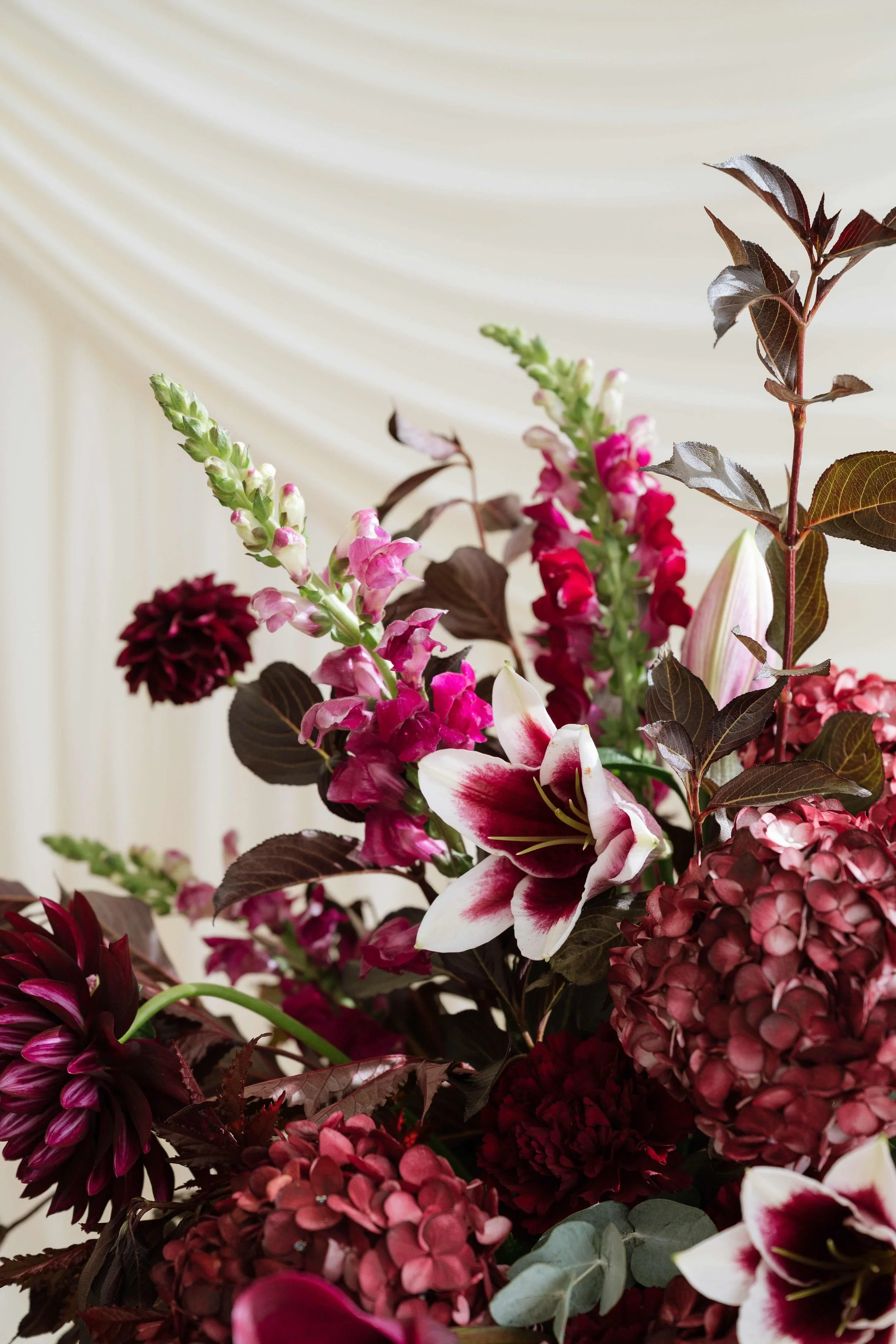 modern blush and burgundy florals with Anthurium and ranunculus  by Love Letter Florals & Events Seattle wedding florist and planner