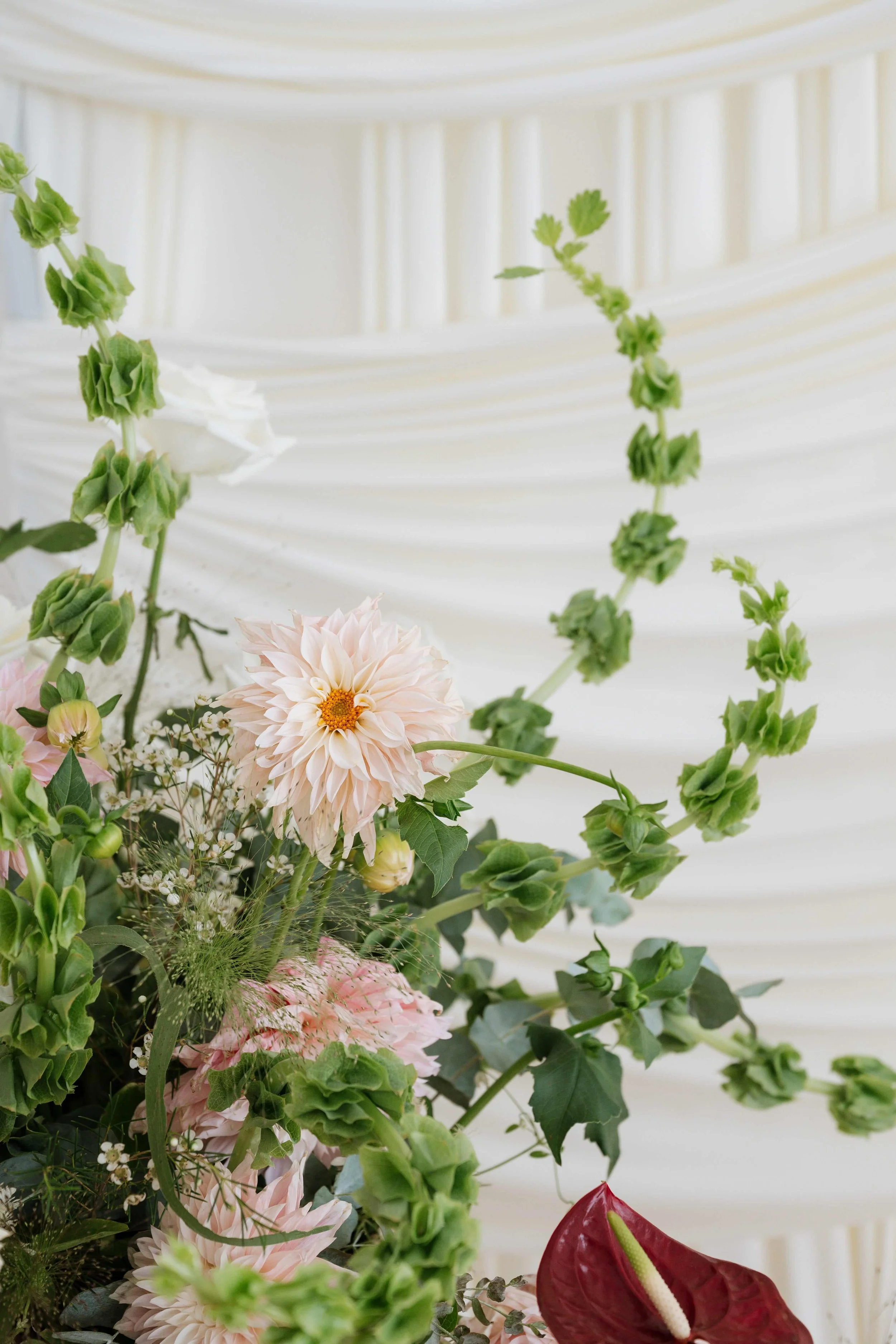 Modern blush and burgundy florals at Seattle wedding hall by Love Letter
