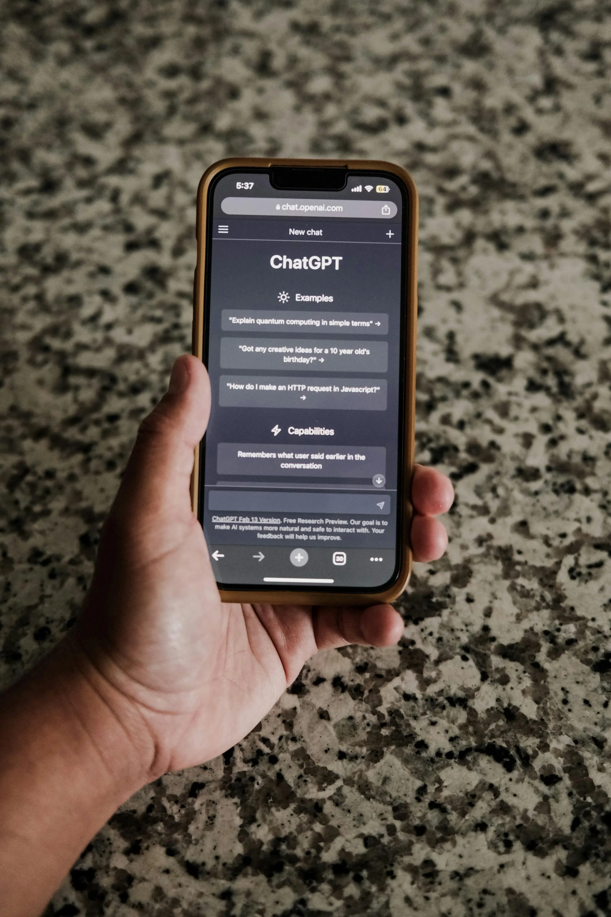 Hand holding a smartphone to use chatgpt for marketing for financial advisors