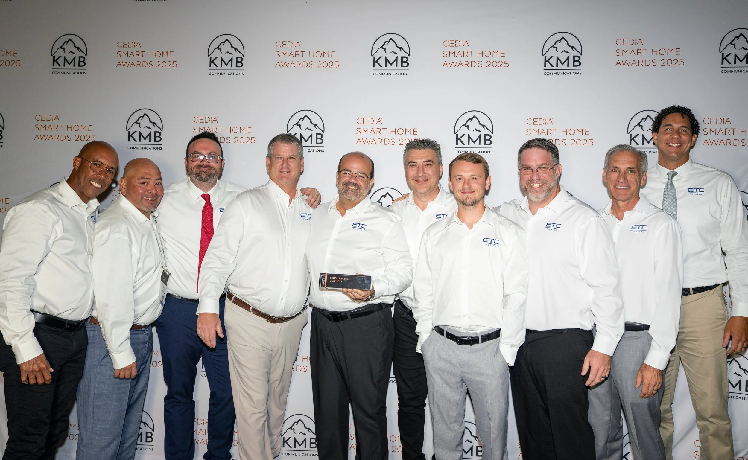 ETC Florida team accepting the Excellence in Business award at the 2025 CEDIA Smart Home Awards