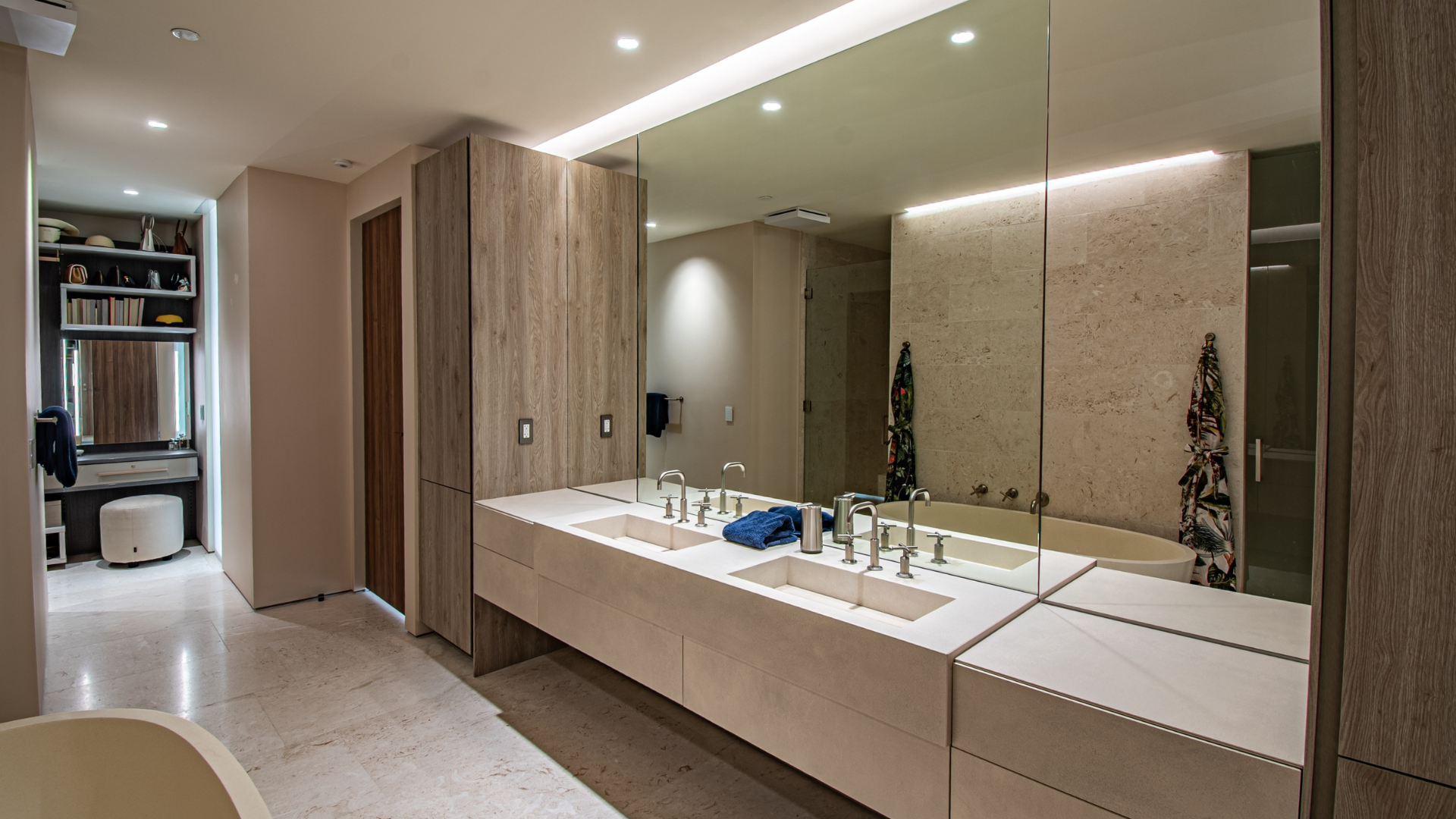 Primary bathroom with cove and mirror lighting, tuned to hold the same color as the rest of the home