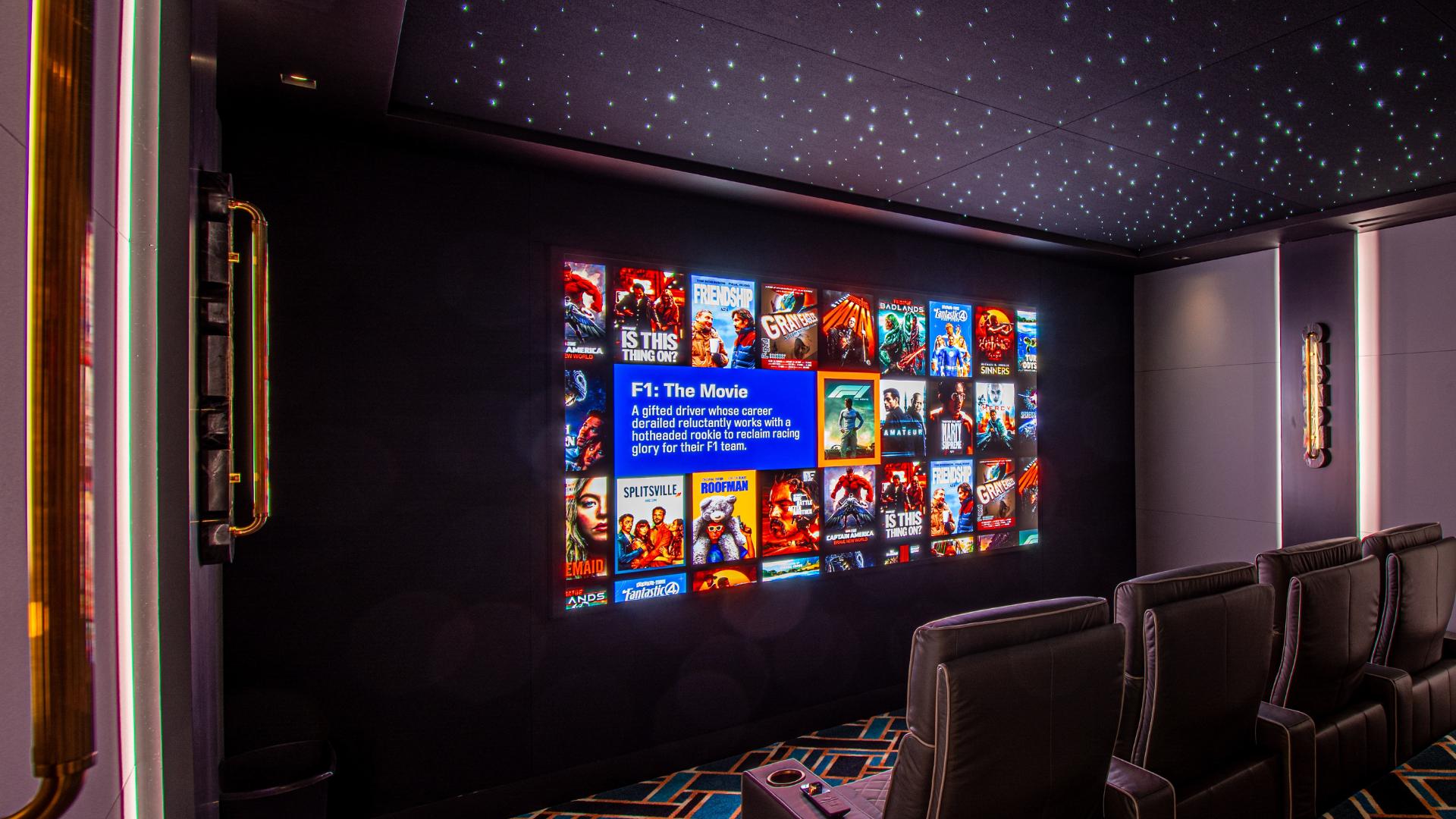 Dedicated home theater with a direct-view LED wall, star ceiling, and four rows of tiered seating