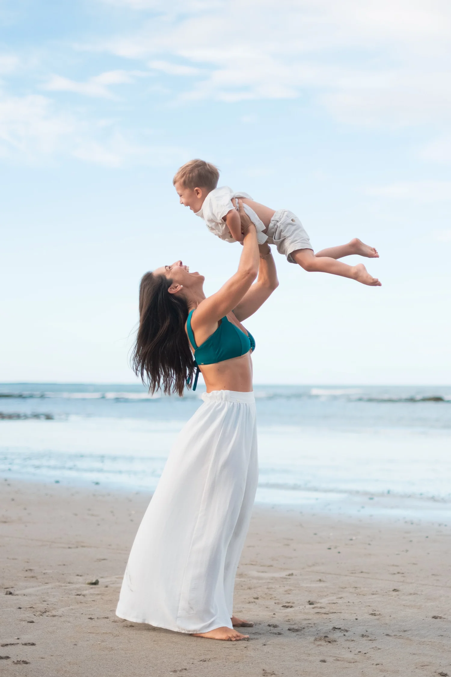 Kelly on the beach with her son