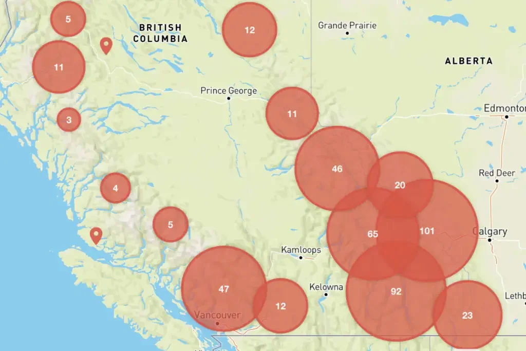Map of Alberta and British Columbia with red circles indicating different locations and numbers inside, representing data points or incident counts.