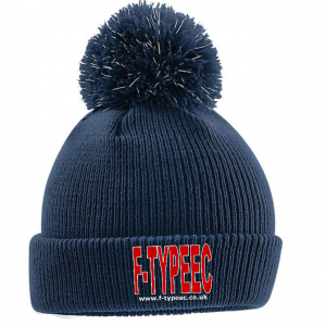 A navy blue knit beanie hat with a pom-pom on top and a red and white G-TYPEEEC logo on the front