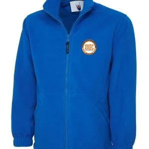 Blue zip-up jacket with a circular logo patch on the left chest.