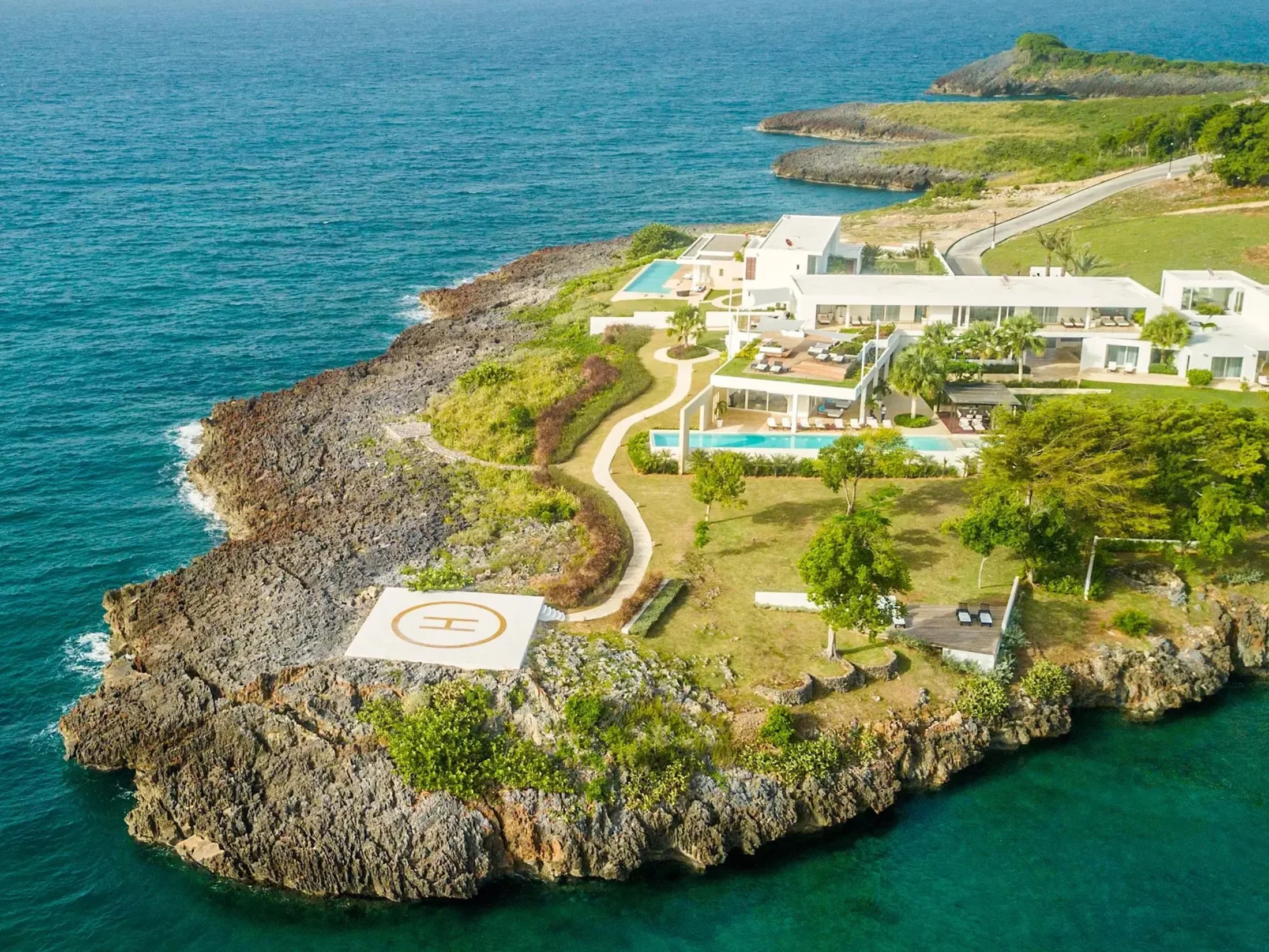 Aerial view of a clifftop villa location with helipad