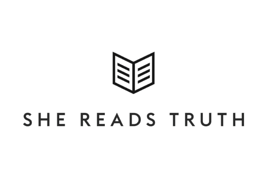 A black background with a simple outline of an open book in the center, and beneath it the phrase "SHE READS TRUTH" in gray text.