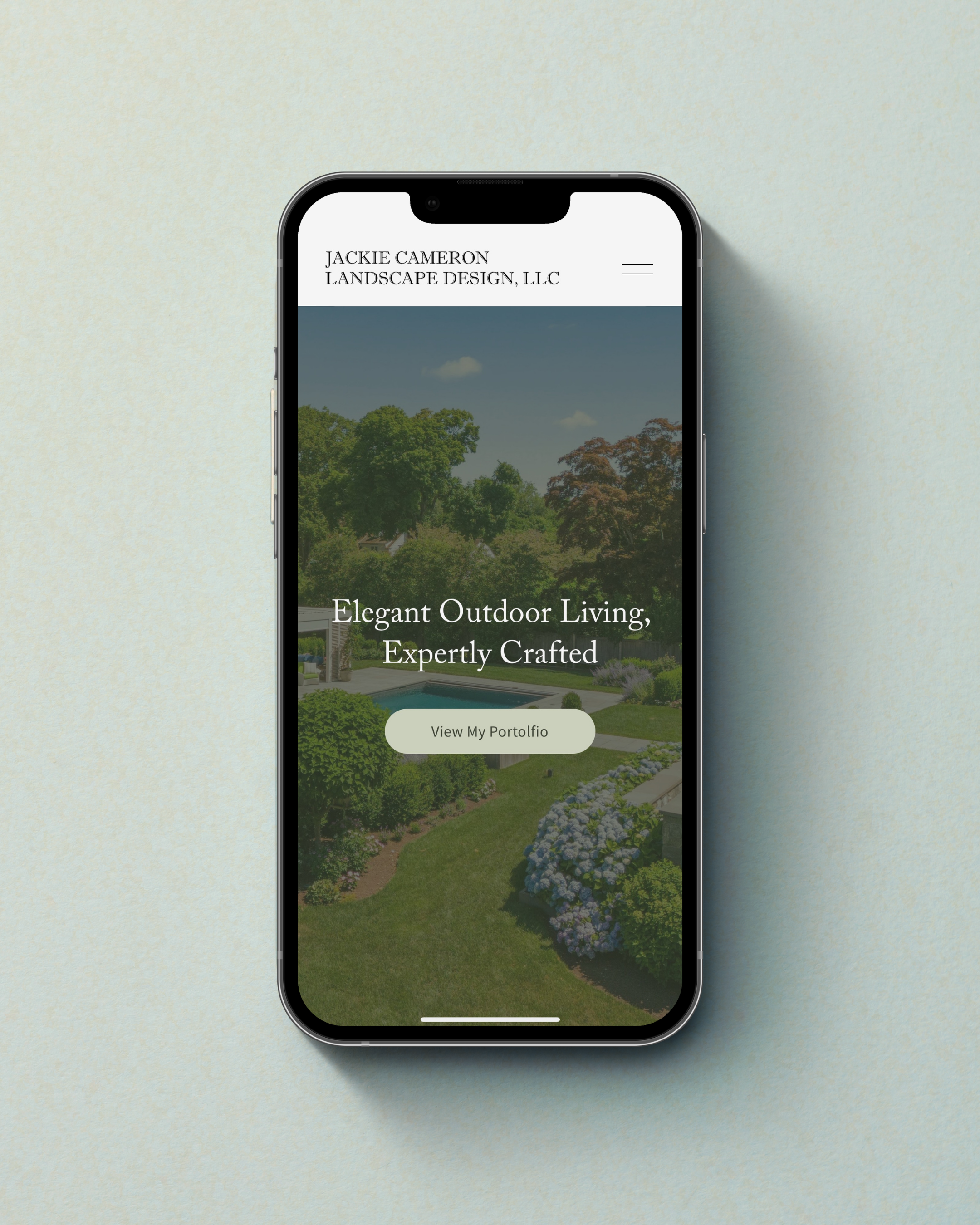 Responsive, elegant custom Squarespace website layout displayed on a mobile phone screen by web designer Maya Noelle.