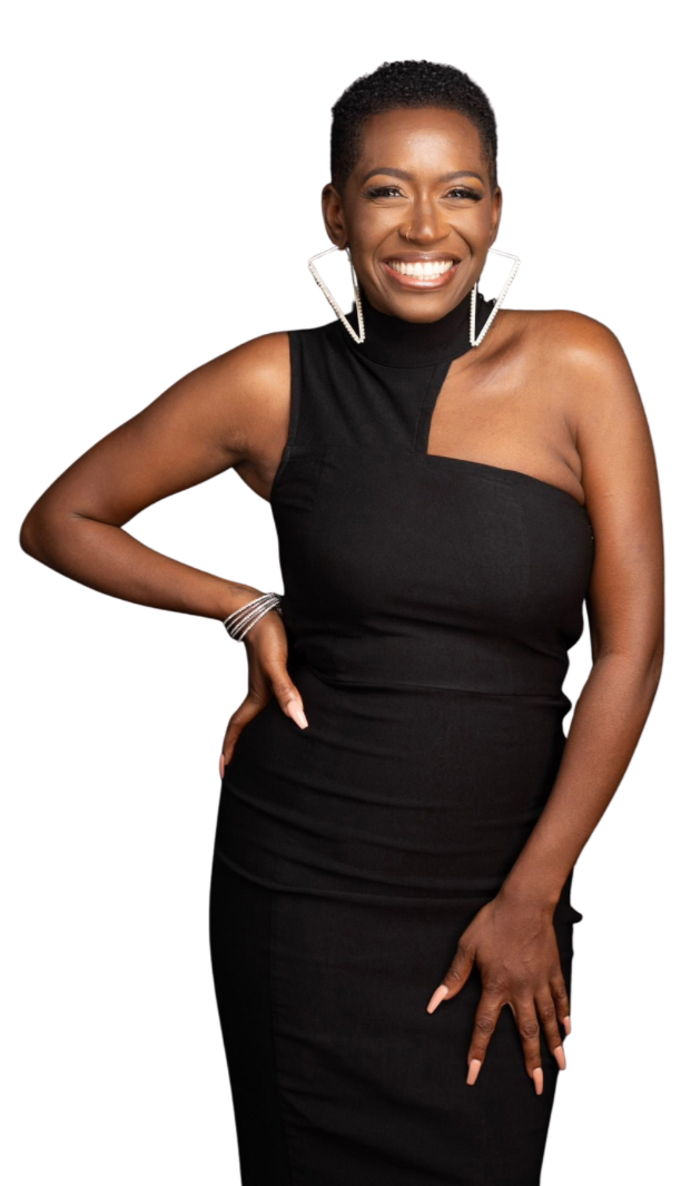 A woman smiling with short curly hair, wearing a sleeveless black dress, large hoop earrings, and a bracelet, standing against a plain background.
