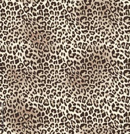 Close-up of leopard print fabric with tan background and black spots.