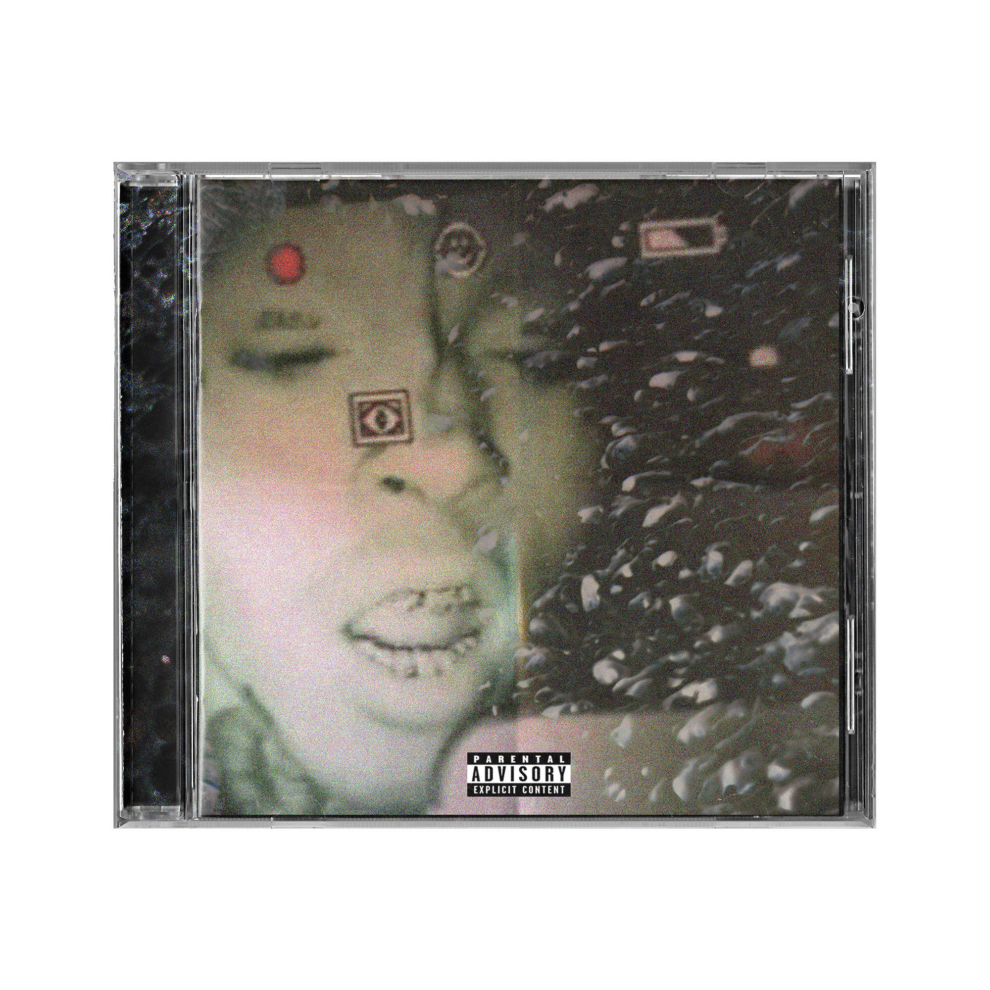 Close-up of a cassette tape with black and silver design, featuring a parental advisory label at the bottom.