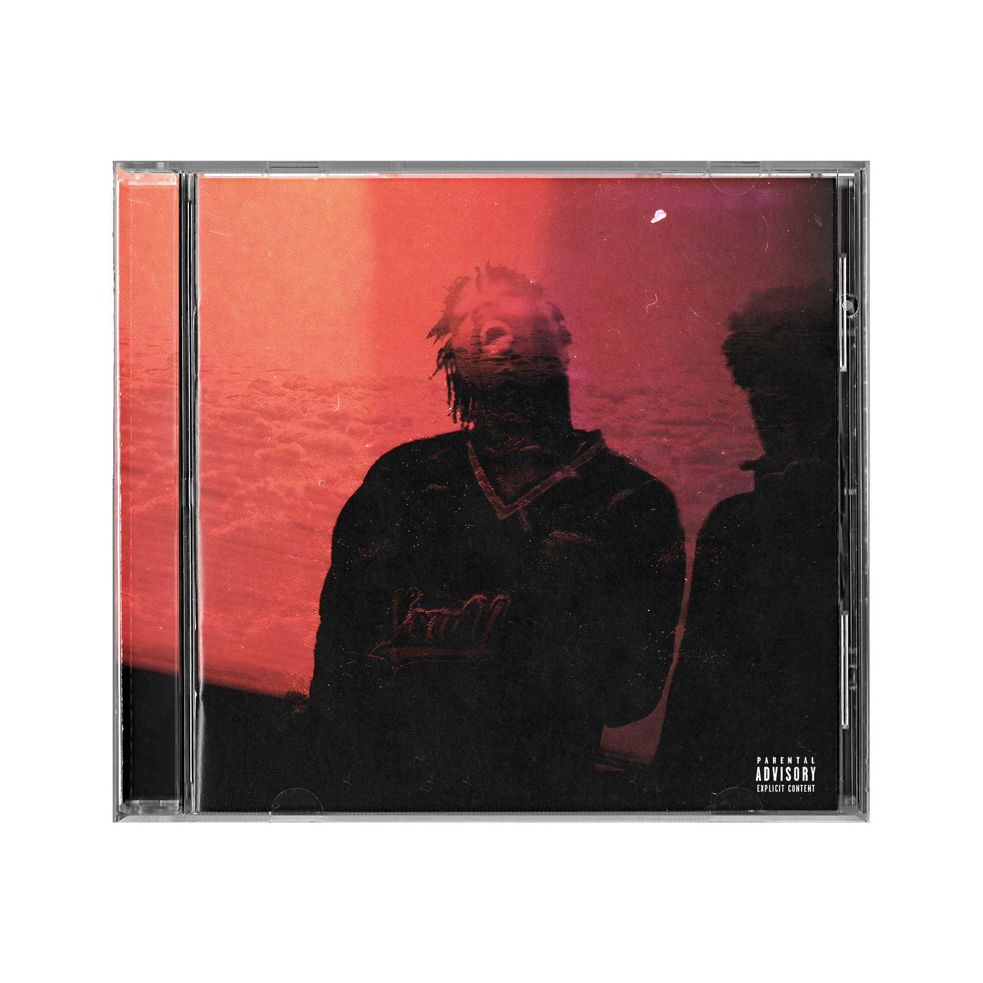 Close-up of a CD case featuring an album cover with a dark silhouette of a person with dreadlocks and a red tinted sky background. Text in the lower right corner says 'Parental Advisory Explicit Content'.
