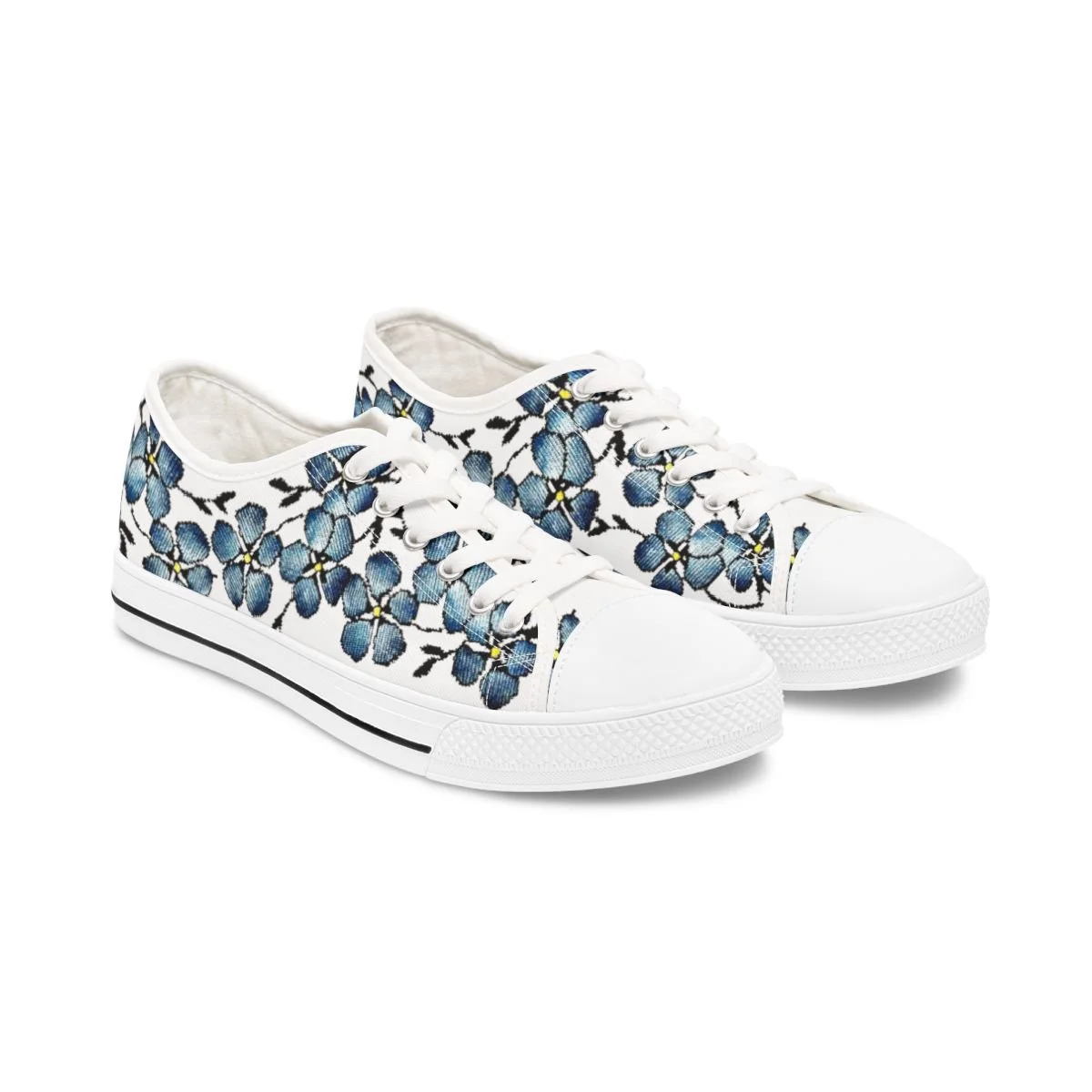 Blue floral pattern on a pair of low top tennis shoes.