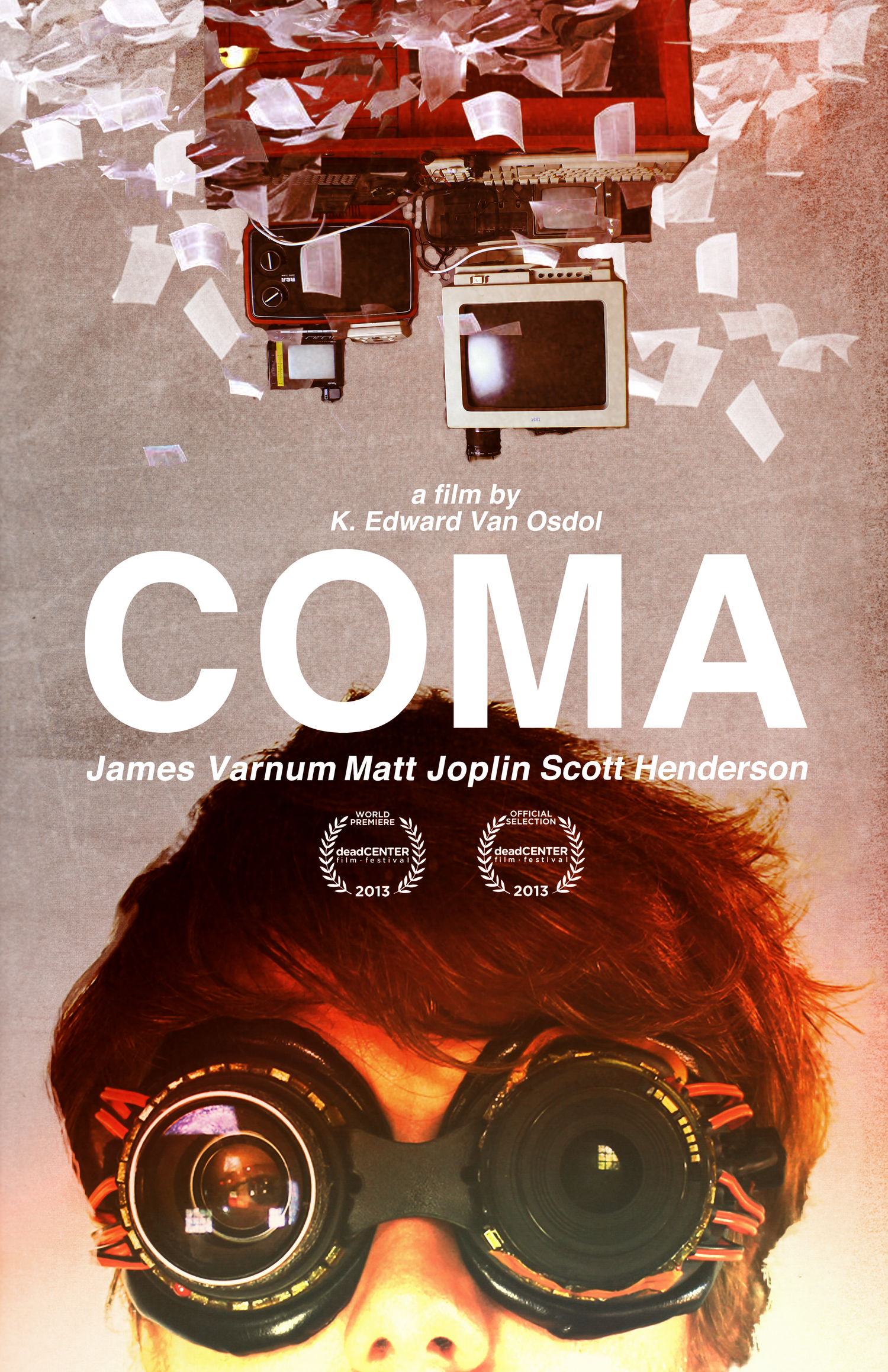 Cover of the film 'Coma' by K. Edward Van Osdol, featuring a person with goggles that reflect a cityscape, with paper scattered around and text about the film's cast and festival awards.