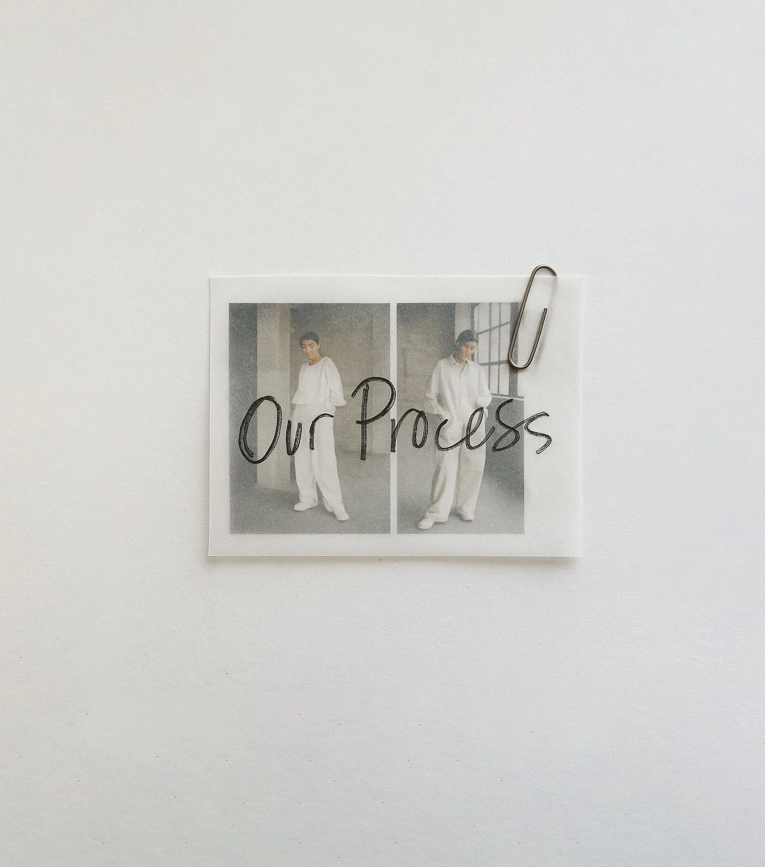 Photograph of two women in white outfits, labeled 'Our Process', attached to a white wall with a paperclip.