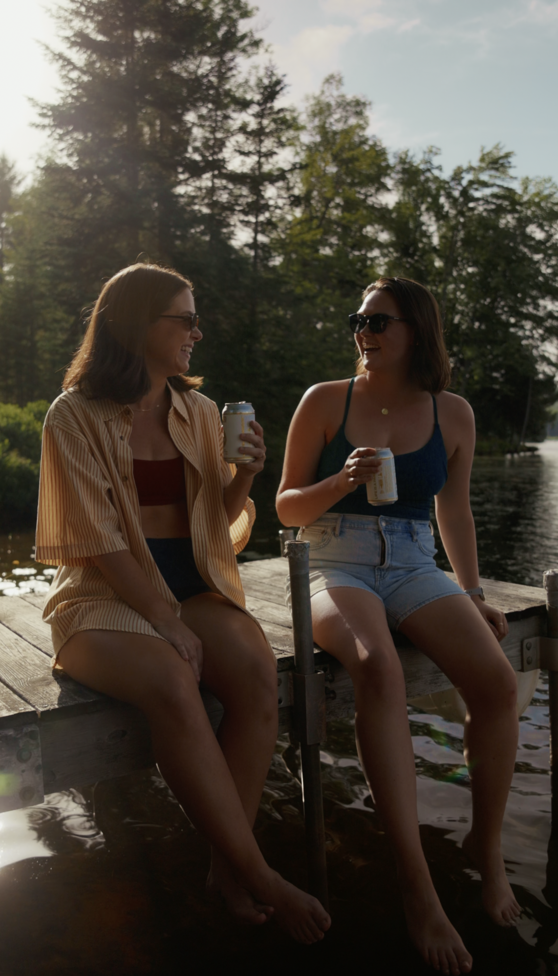 Pilsner Light Campaign,  two women sitting at a dock in the adirondacks