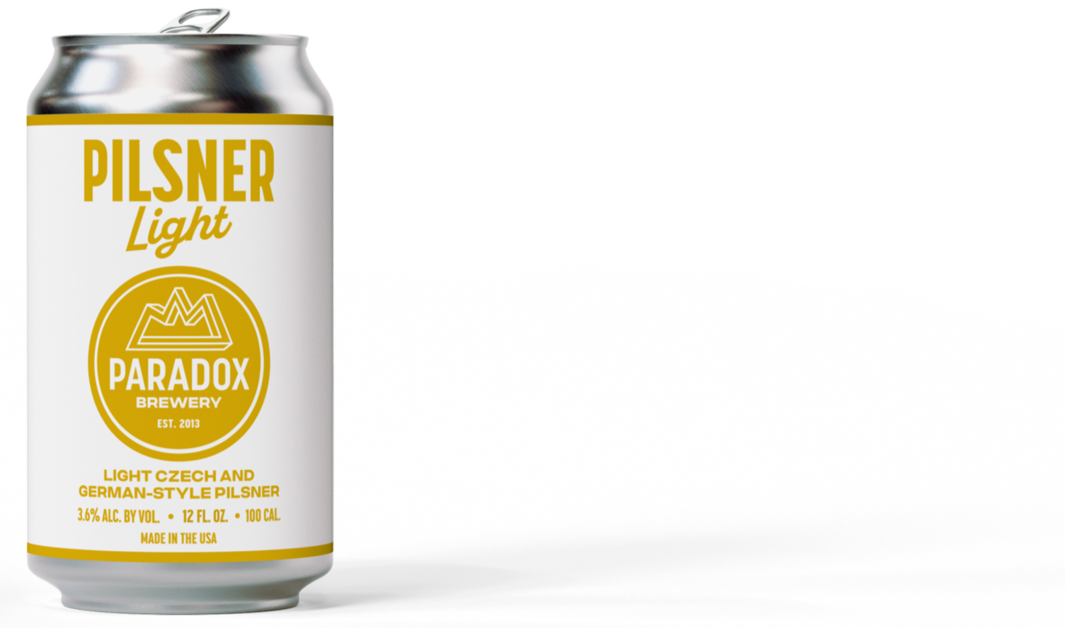A can of Pilsner Light beer from Paradox Brewery, with yellow and white label, showing alcohol content of 3.6%, 12 fl oz, made in the USA.