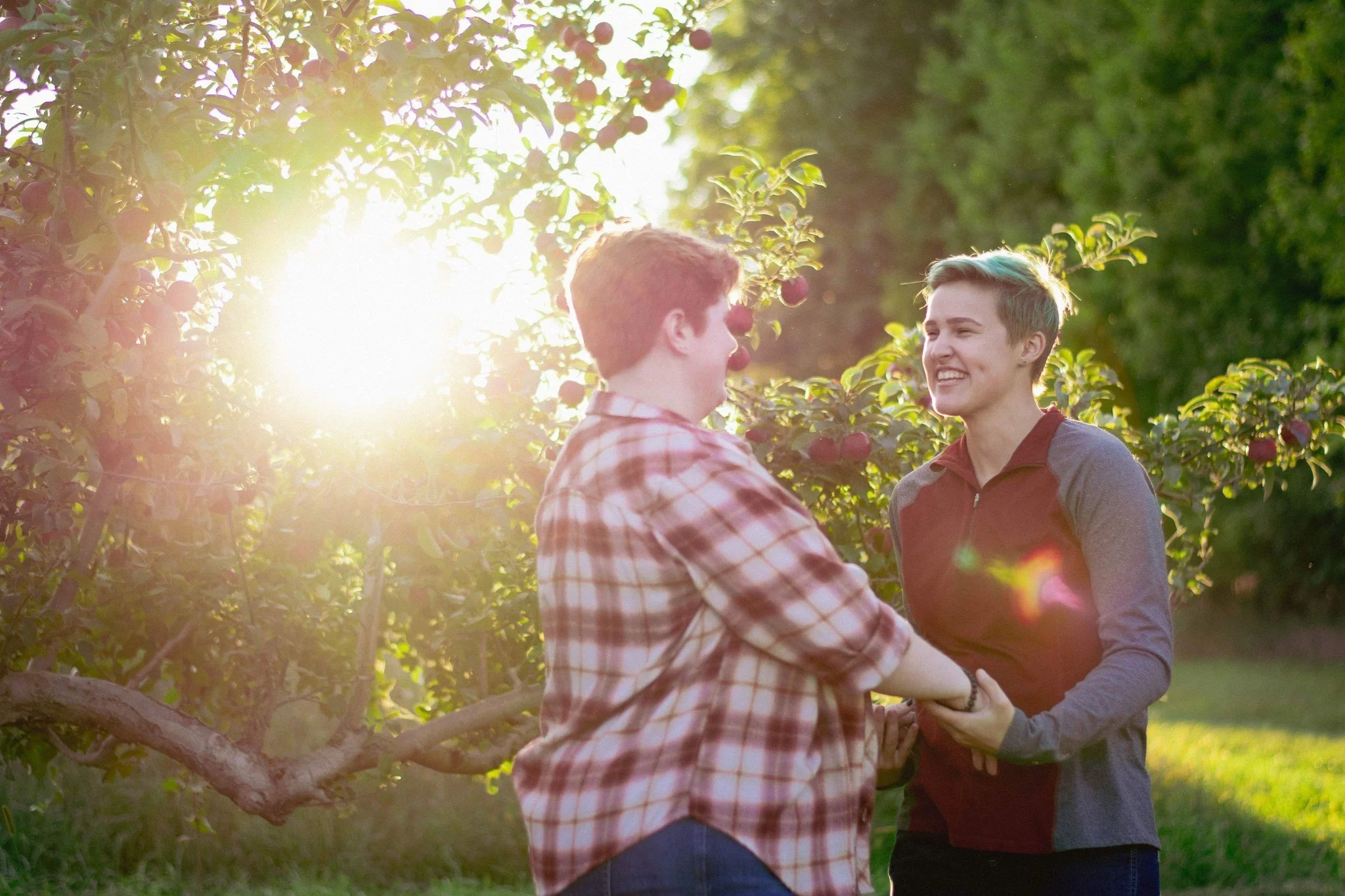 Couple laughing in golden hour light, couples photographer in Dexter, MI