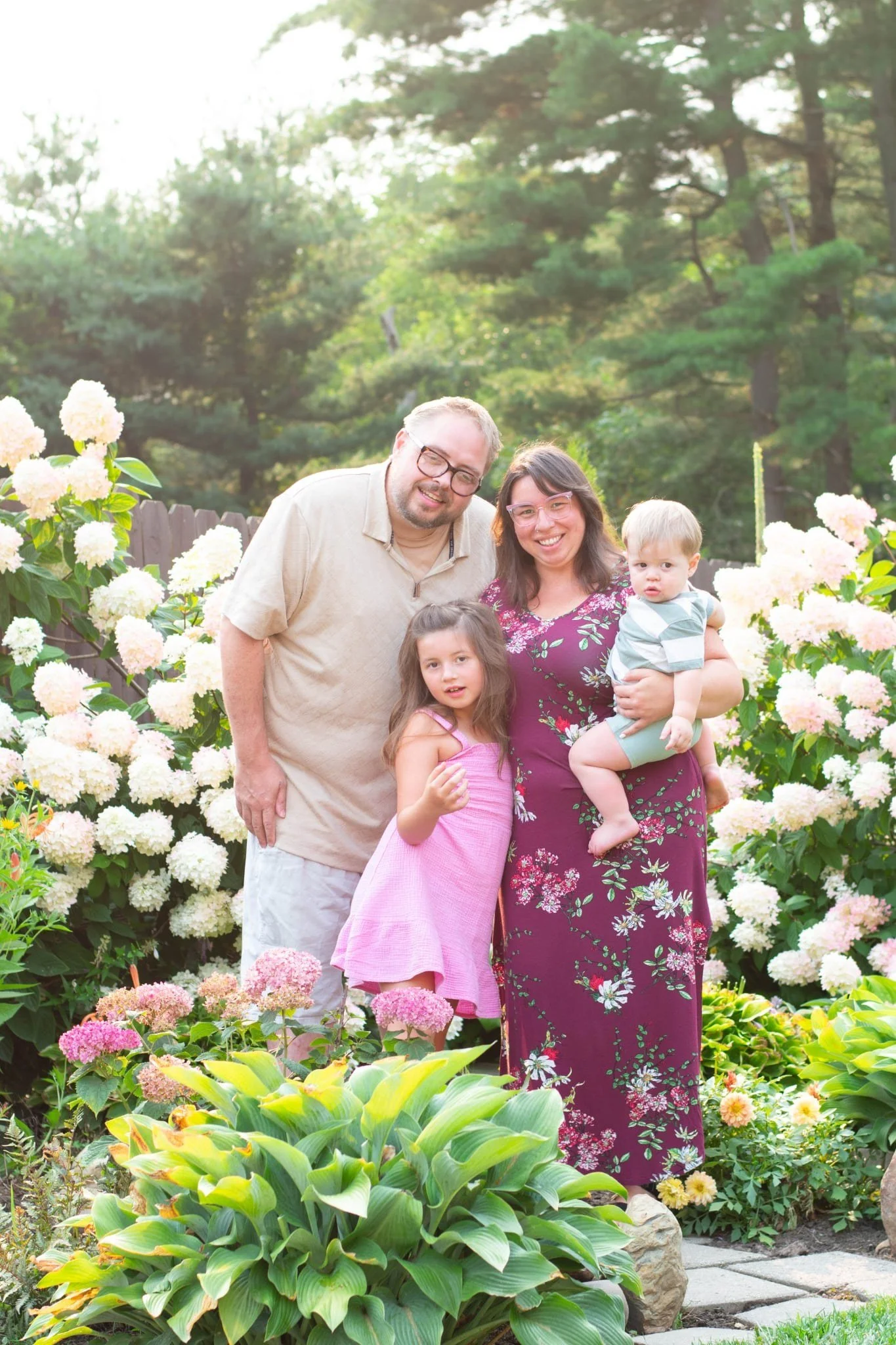 Family portrait session among blooming hydrangeas, family photographer in Manchester, MI