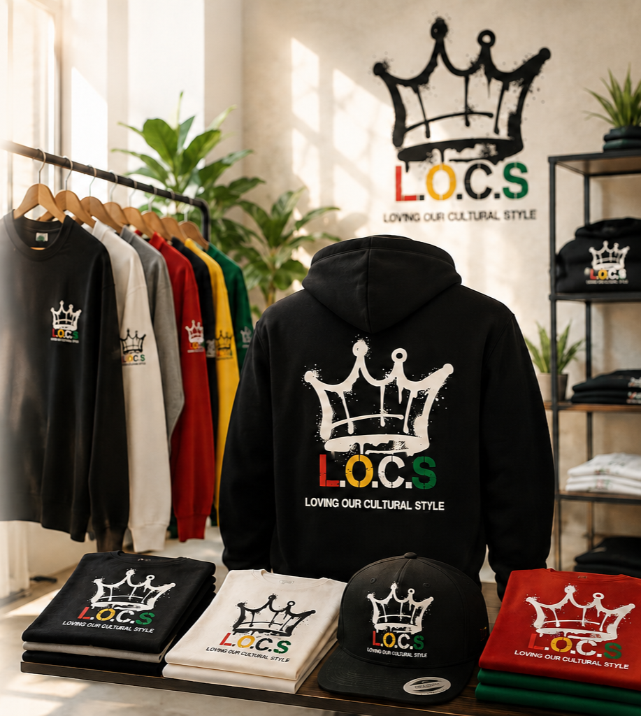 Clothing store display with sweatshirts, caps, and T-shirts featuring a crown logo and the text "L.O.C.S" in red, yellow, and green, and the phrase "Loving Our Cultural Style" underneath.