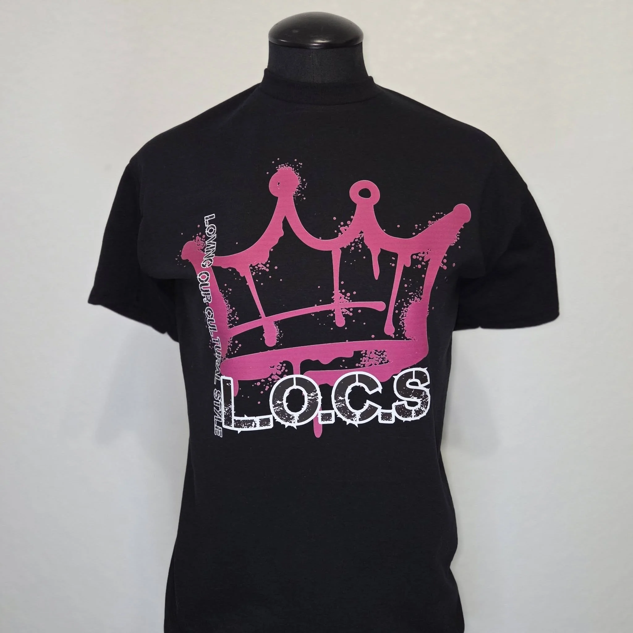 Black T-shirt featuring pink graphic and white text.