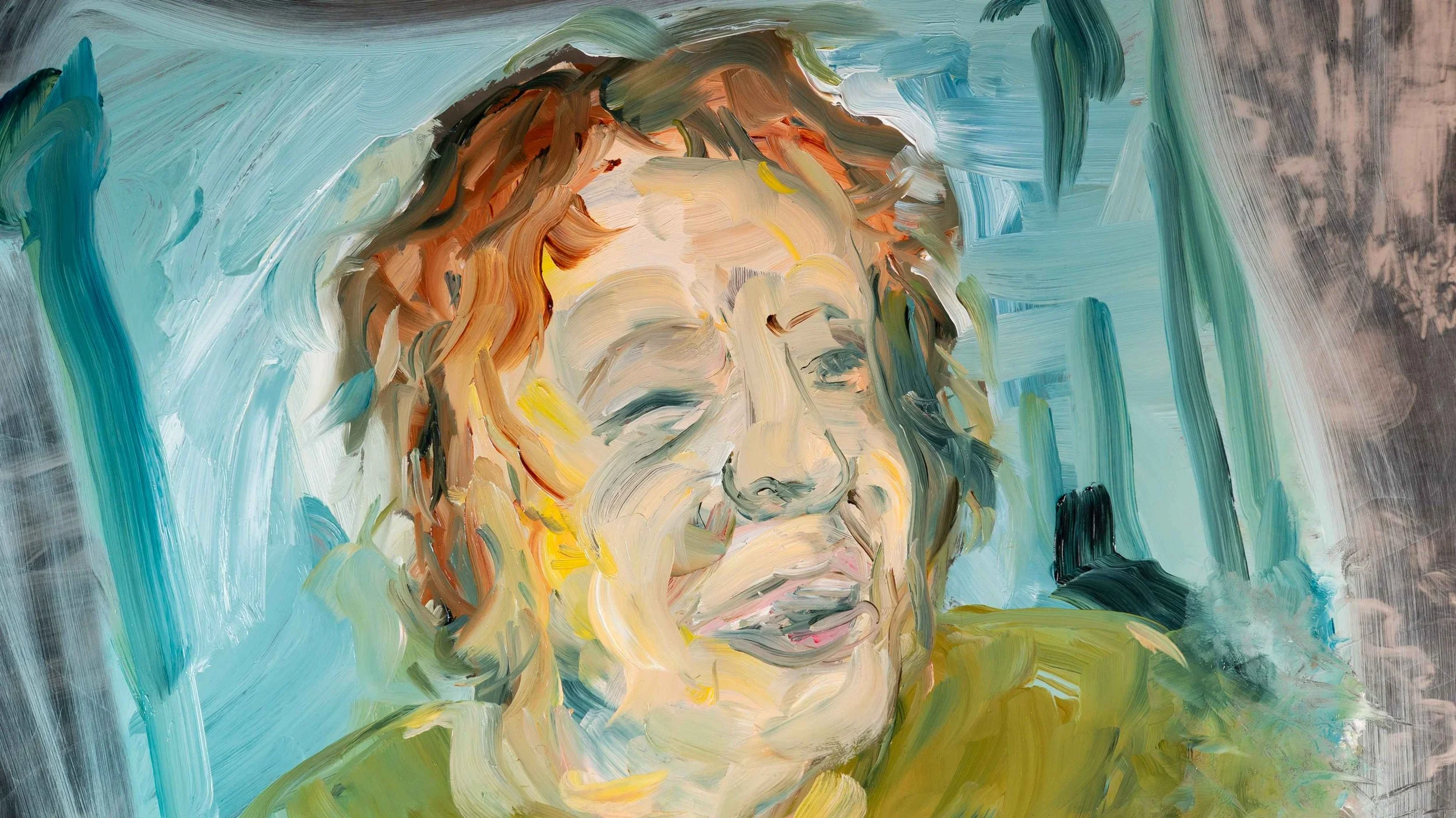 Close up oil painting of Kim Kilpatrick’s
face, a light skinned woman in blues with
yellow accents. Brush stokes form her eyes,
nose and mouth that are turned upward in a
smile. Her face is framed with her short auburn
hair.