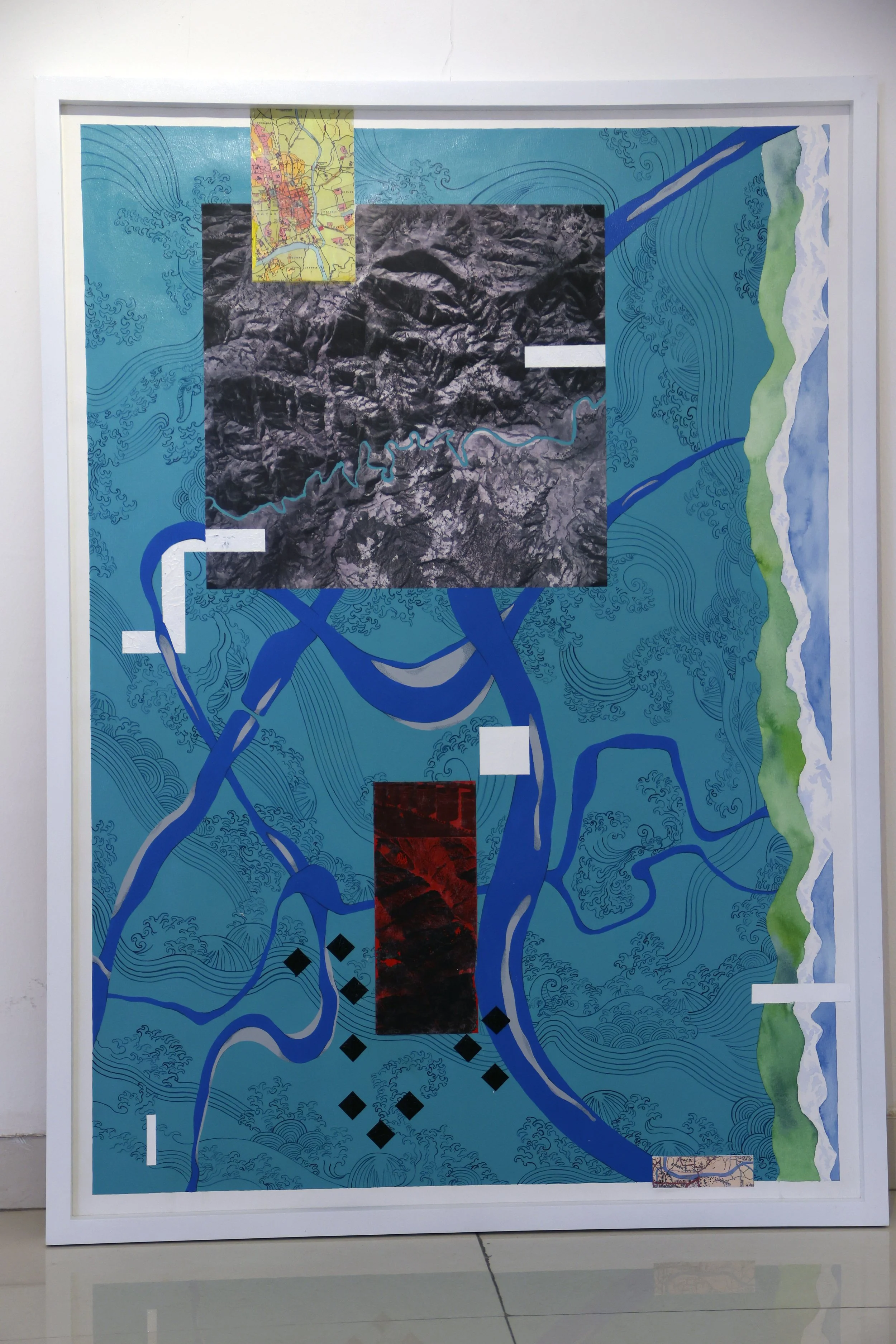 Mixed media artwork featuring a topographic map, satellite image, and illustrative patterns in blue, green, black, and white, with additional small map sections and abstract design elements.