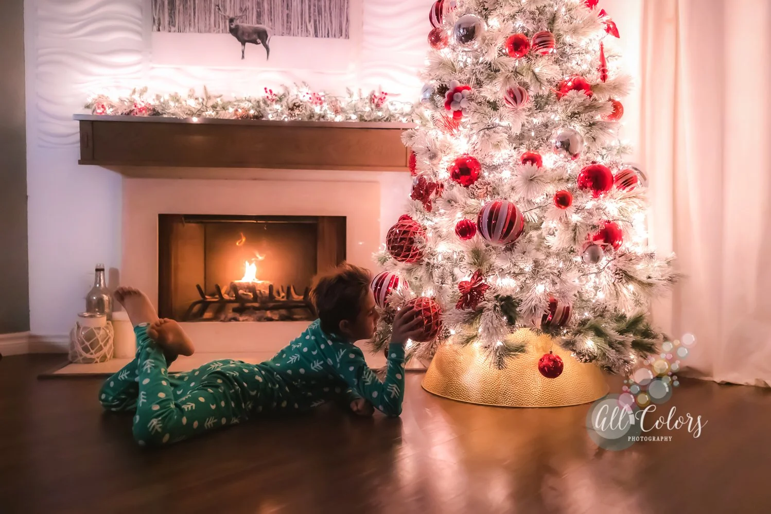 Boy playing with the Christmas Tree ornaments