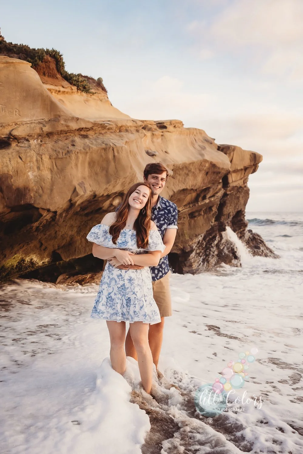 young couple hugging each other on a San Diego Beach.