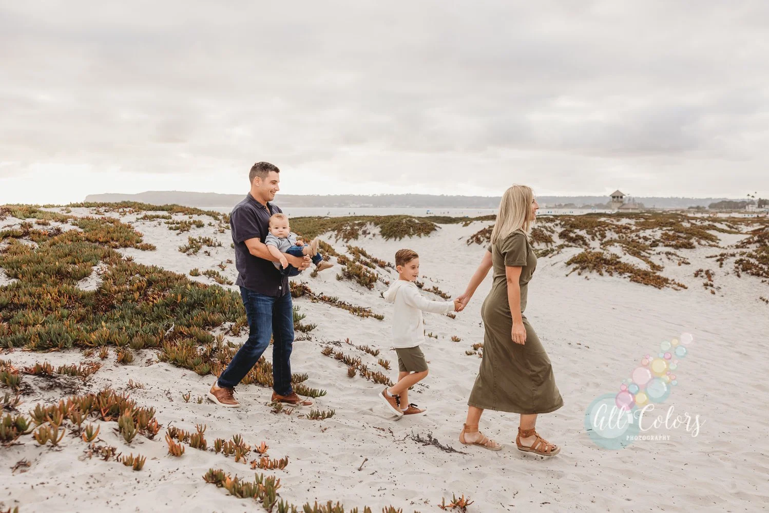 Family walking on the dunes of Coronado, CA.