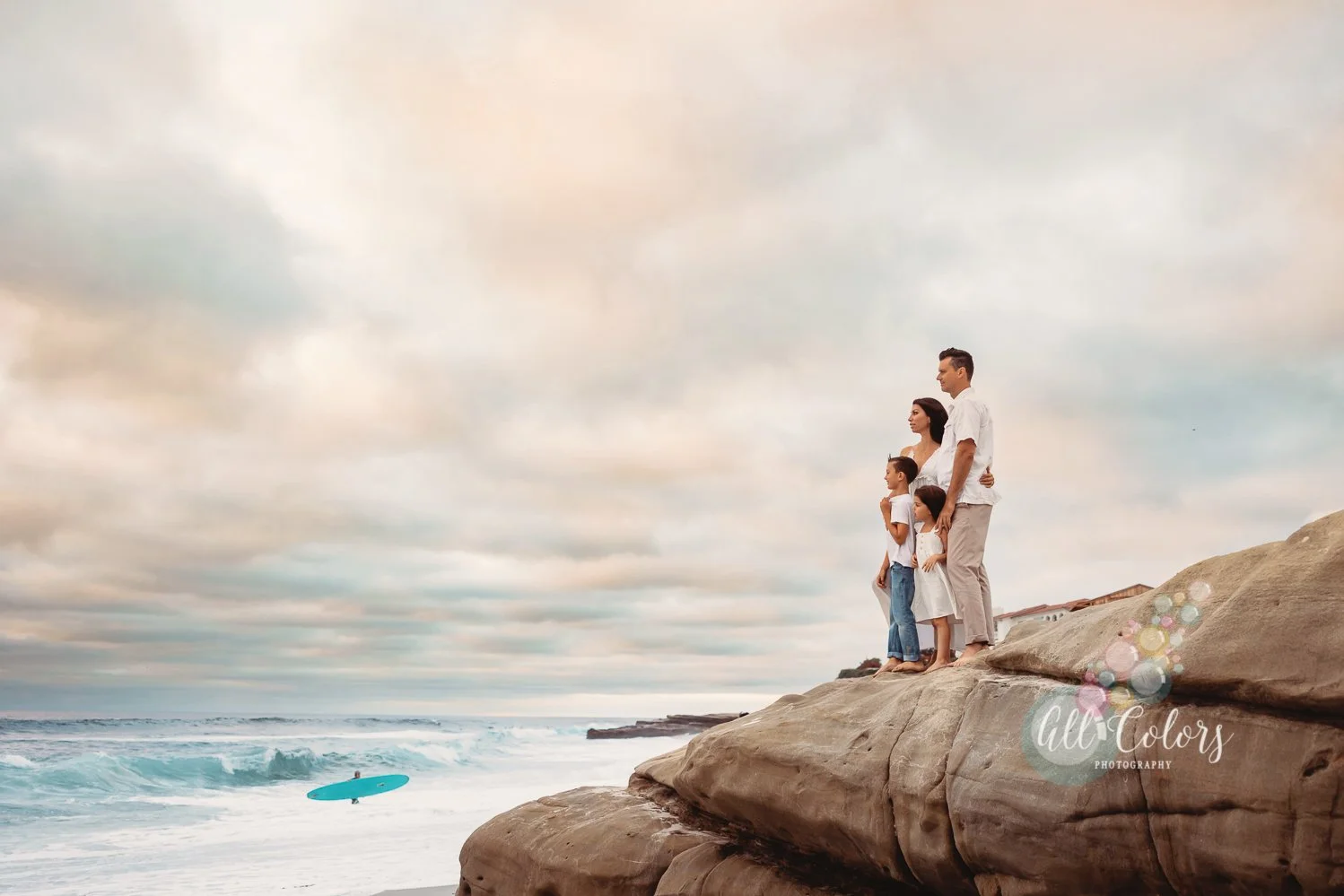 family on a cliff in Windansea, San Diego CA