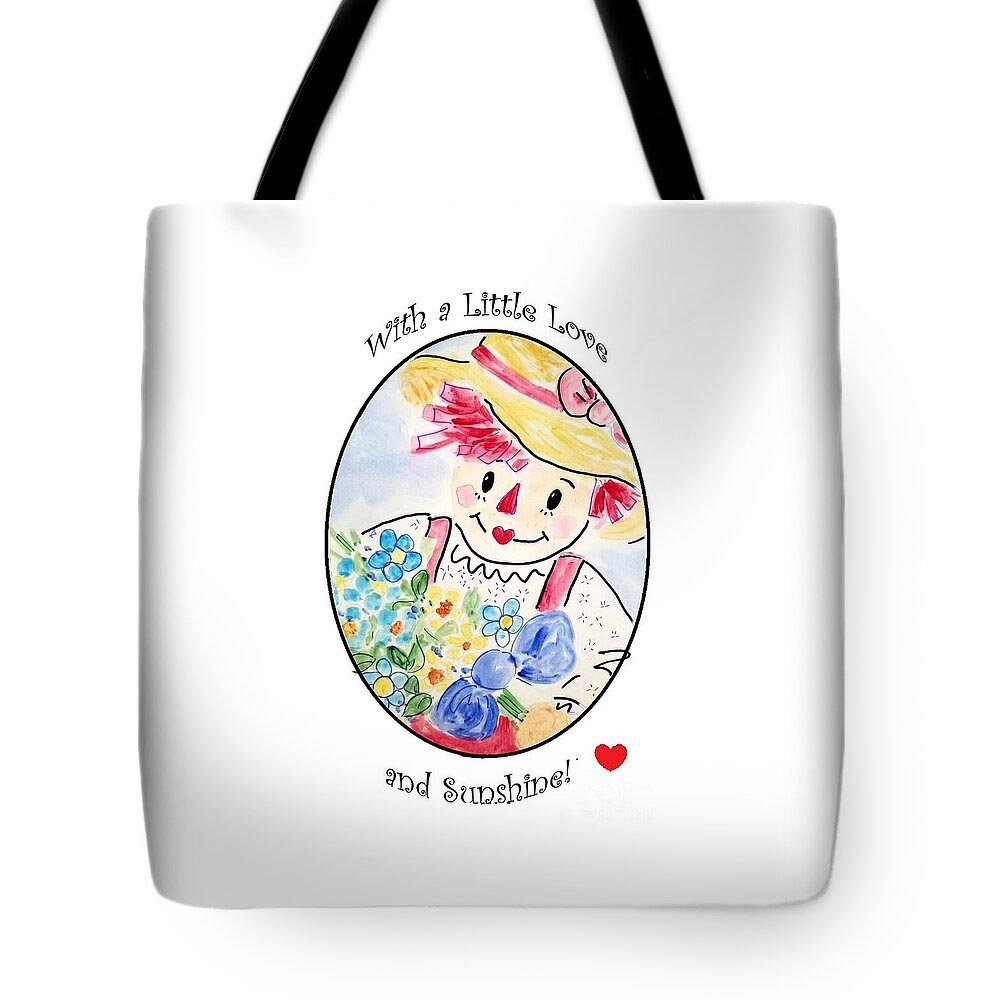 White tote bag with a colorful illustration of a smiling girl wearing a wide-brimmed hat, surrounded by flowers and blueberries. Text above and below the illustration reads "With a Little Love and Sunshine!" and a small red heart is at the bottom right.