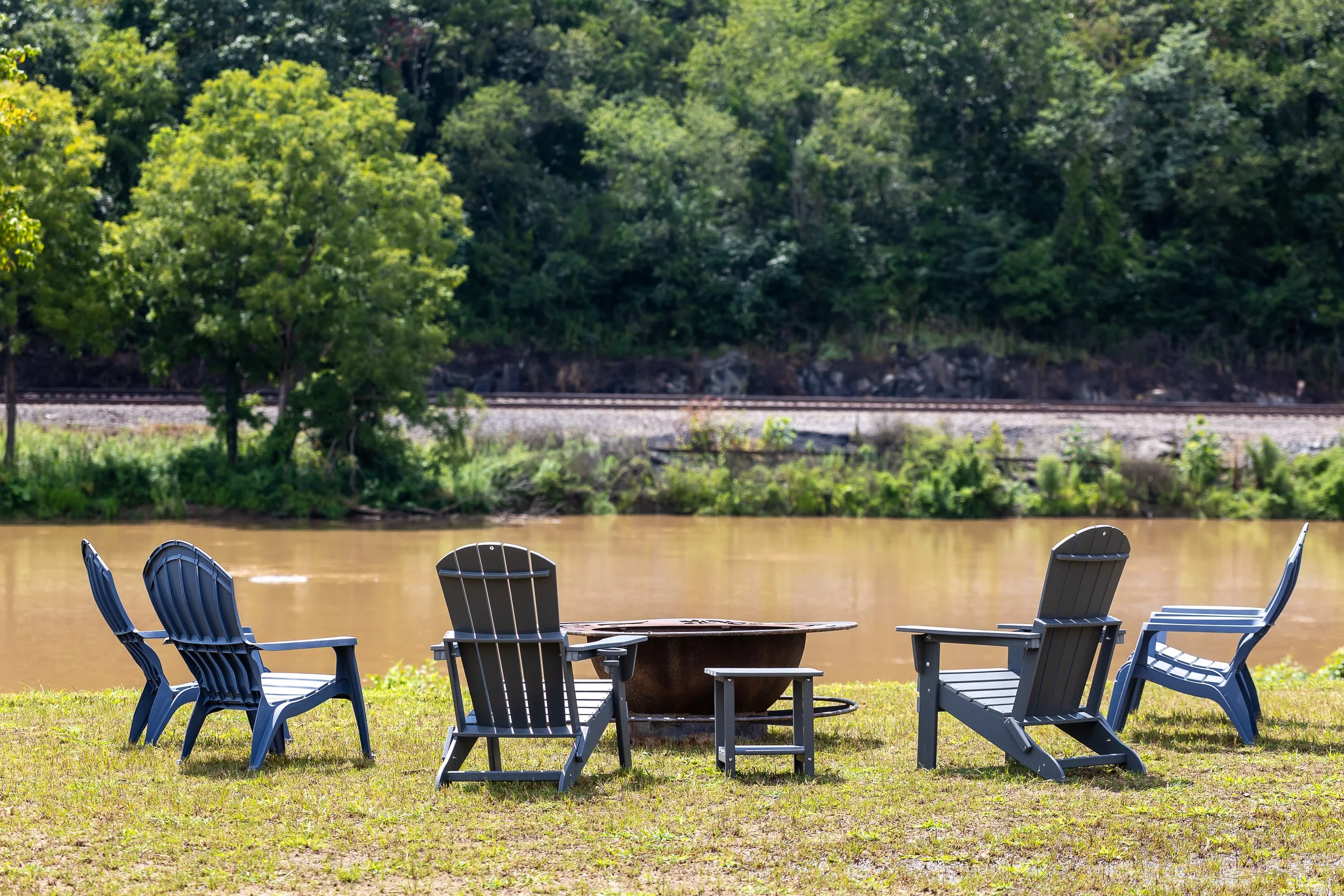Riverbend fire pit and adirondack chairs