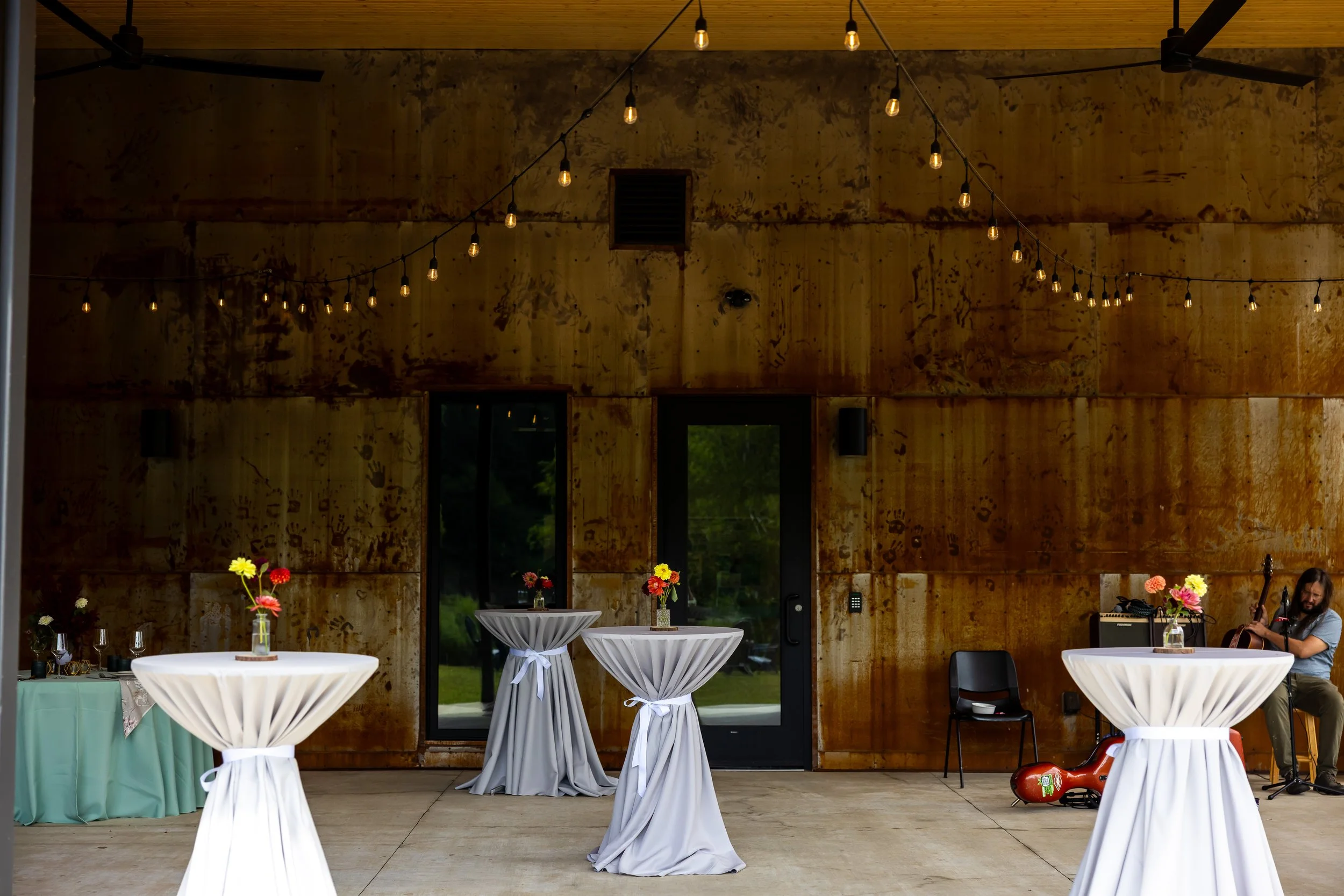 Riverbend covered porch with cocktail tables