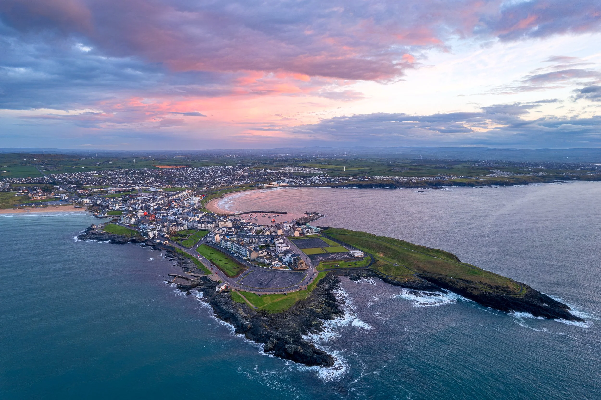Aerial landscape photograph of Portrush, Northern Ireland at sunset.