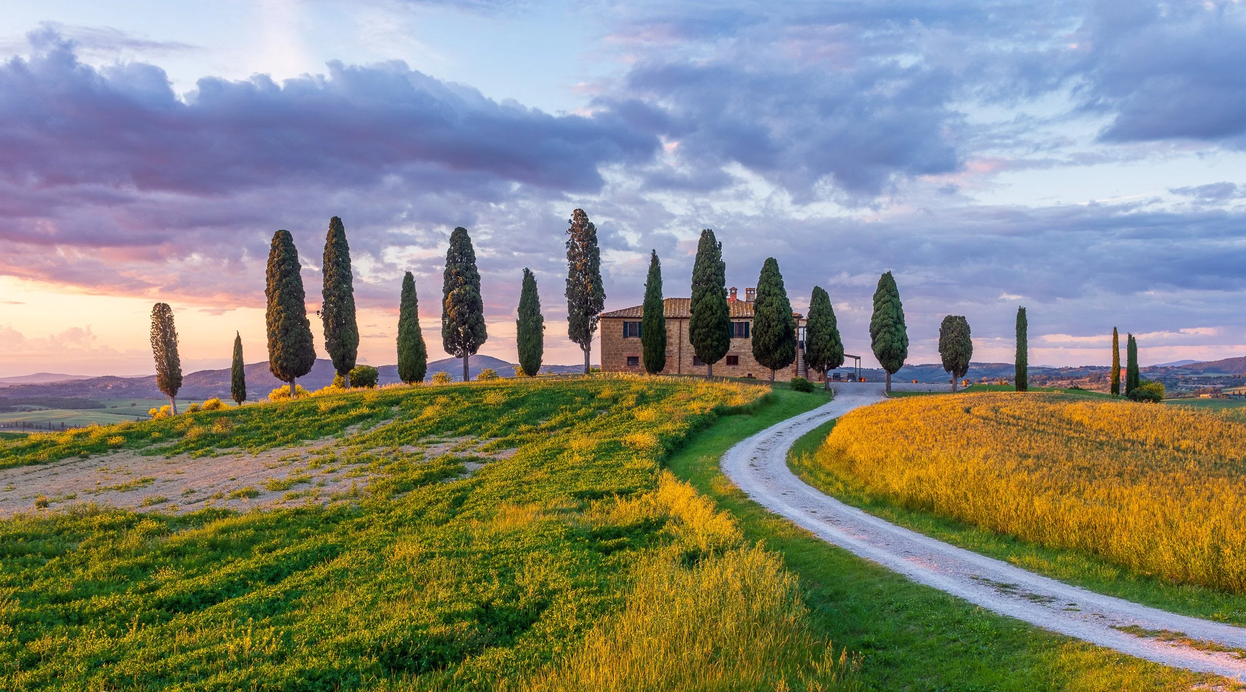 Landscape photograph of Villa I Cipressini, Val d'Orcia, Tuscany, Italy at sunset.