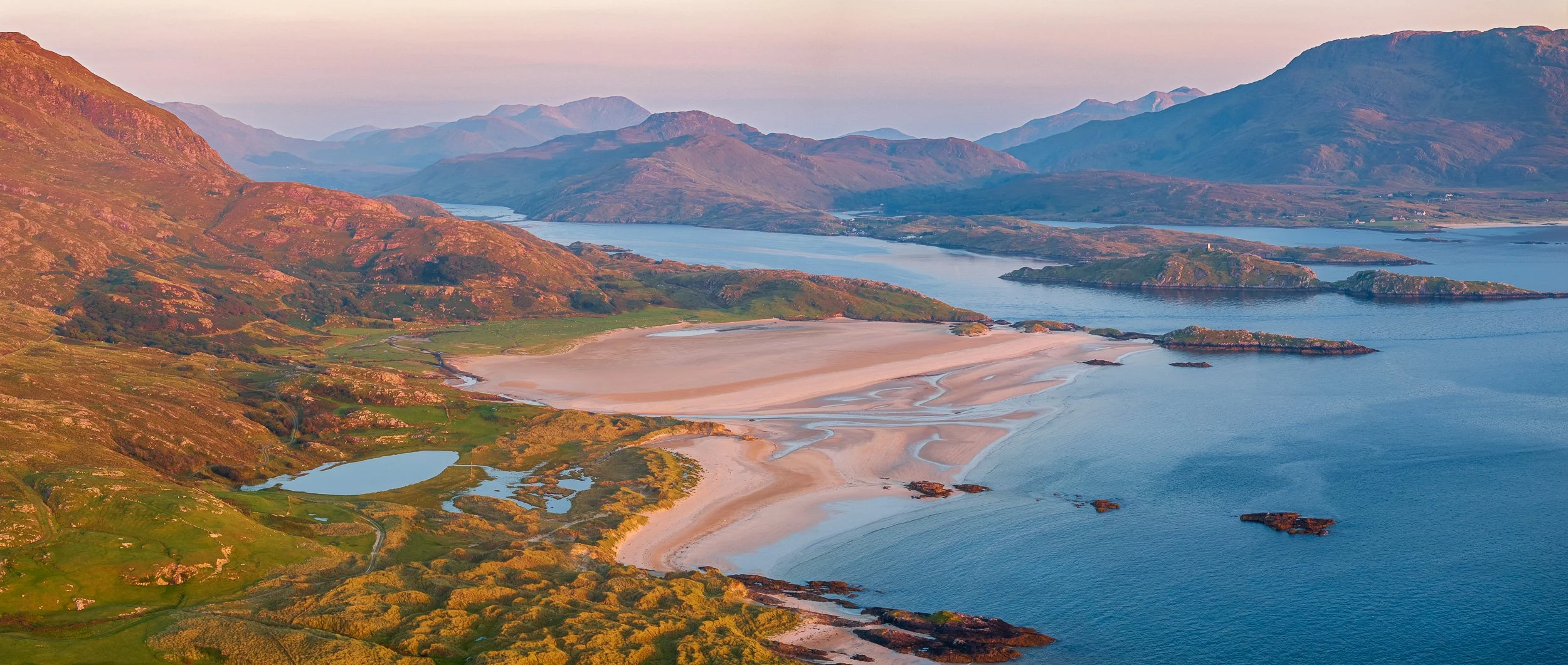 Aerial landscape photograph of Uggool Beach and the Lost Valley, County Mayo, Ireland.