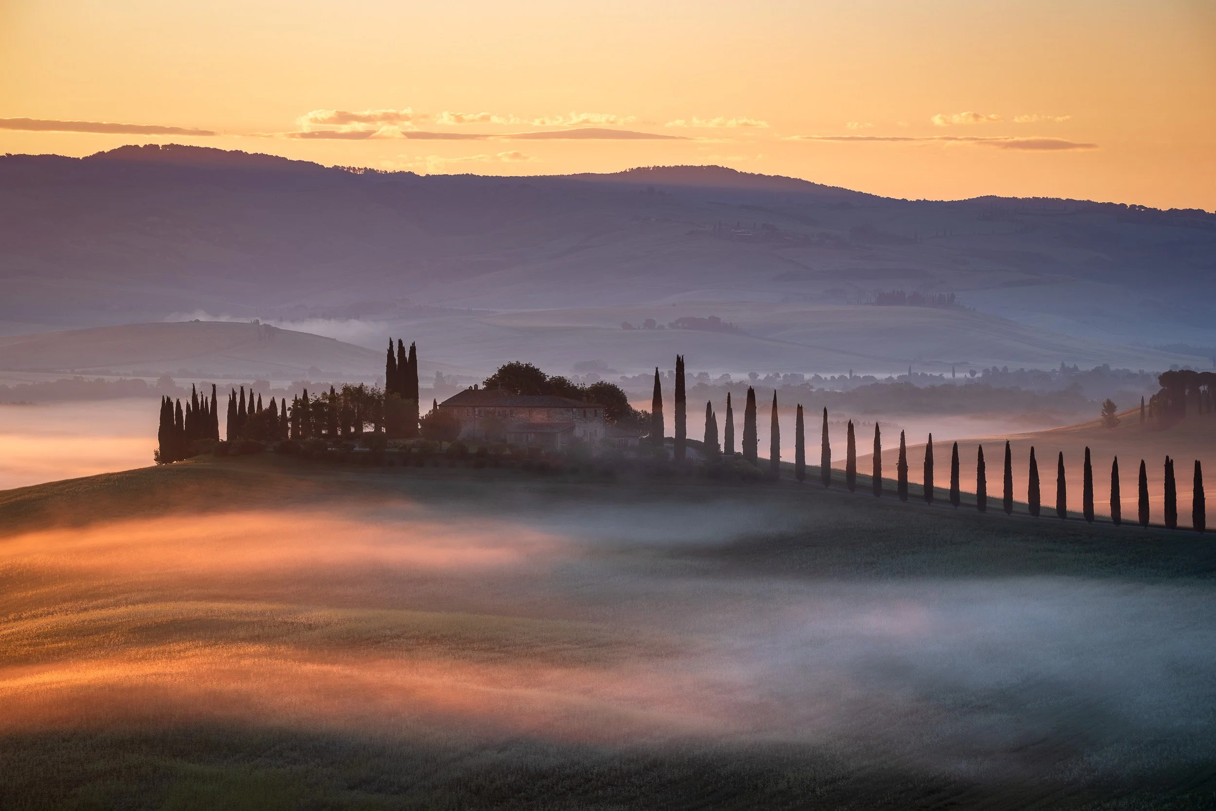 Landscape photograph of Agriturismo Poggio Covili, Val d'Orcia, Tuscany, Italy at sunset.