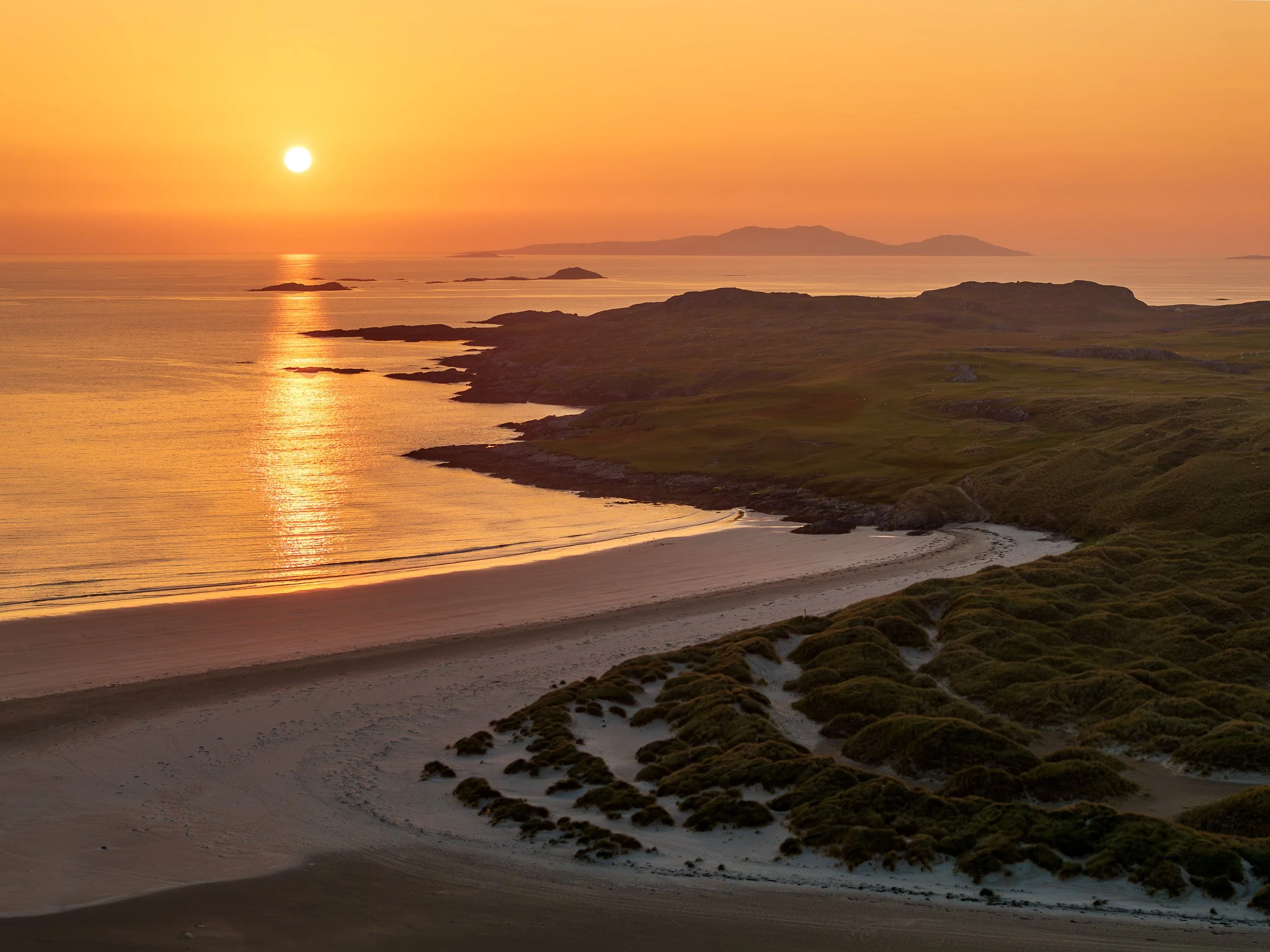 Aerial landscape photograph of Silver Strand, County Mayo, Ireland at sunset.