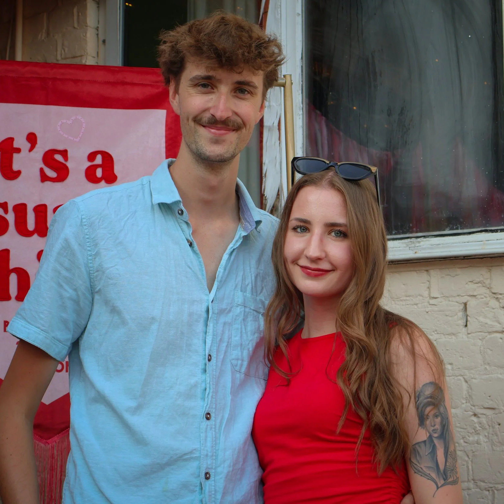 Couple standing next to each other