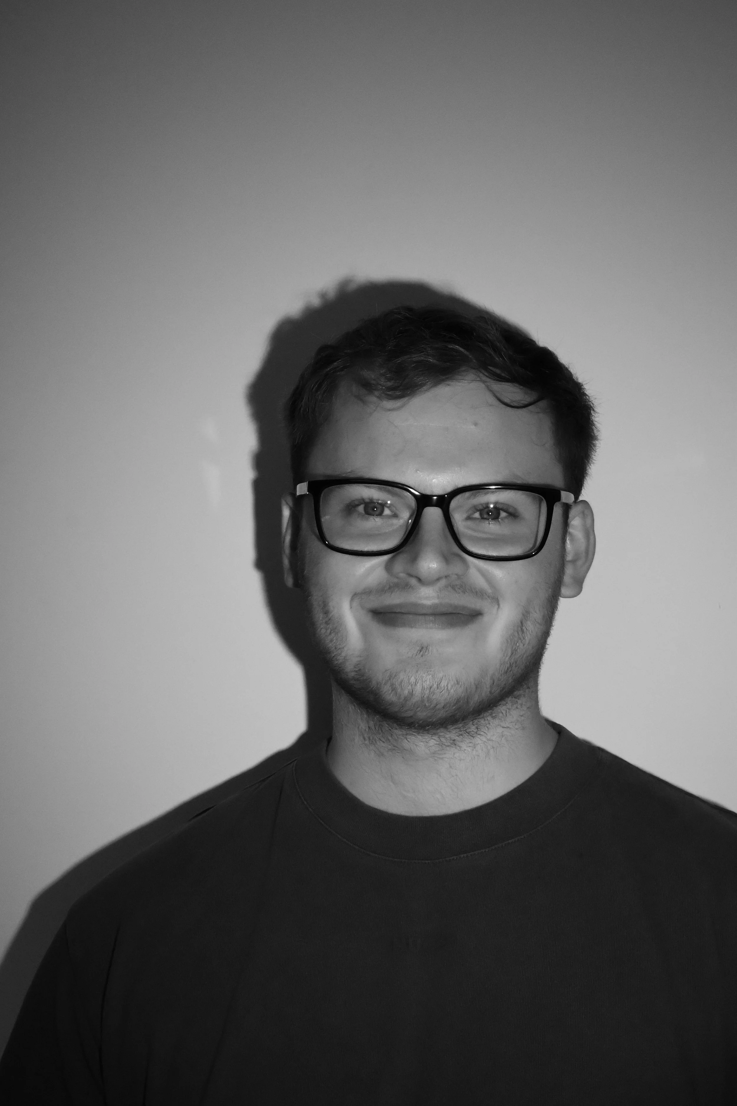 Headshot of man wearing glasses