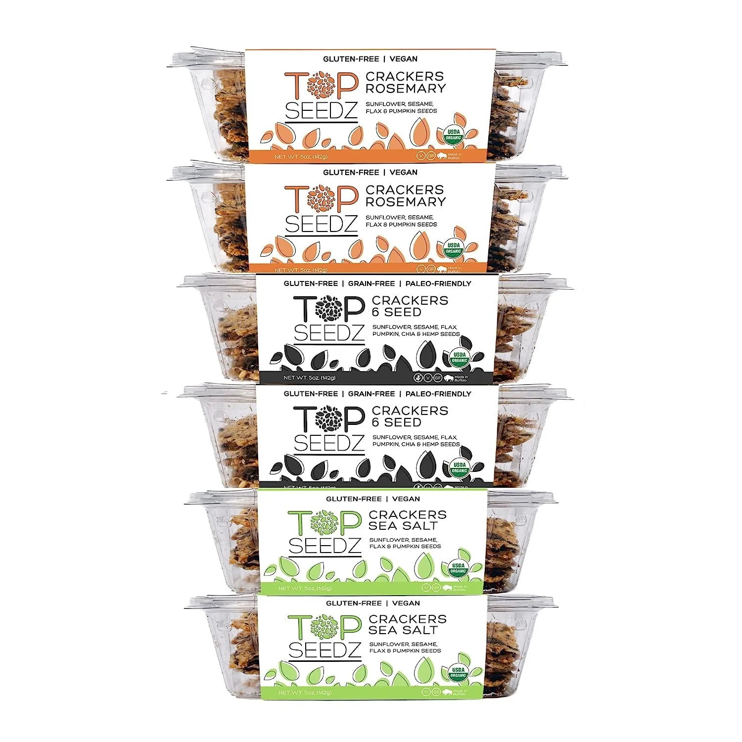 Stacked clear plastic containers of Top Seedz Crackers with different flavor labels: Rosemary, 6 Seed, Sea Salt. Each label indicates gluten-free, vegan, organic, and paleo-friendly options.